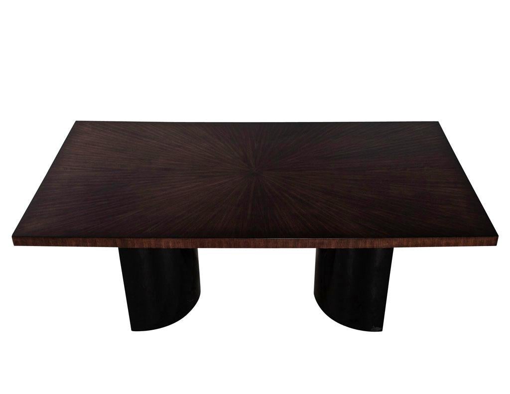 Custom modern walnut starburst dining table with black curved pedestals. Magnificent sunburst walnut top in a medium walnut satin finish. Completed with high gloss black lacquer demi-lune pedestals. Hand crafted in Canada and ready to ship. Price