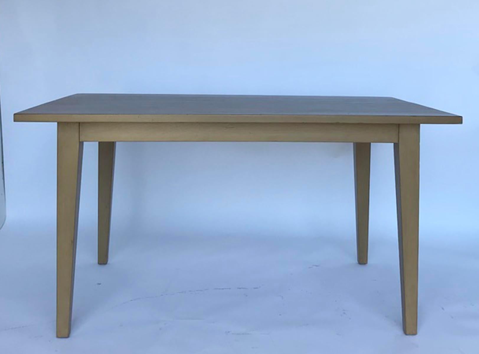 Custom modern table with two separate 18 inch extension leaves that slide in on each side. Starting out at 60 inches long and expands to 96 inches. As shown, in Walnut, with custom finish. Can be made in a variety of finishes and in any size. 
Made