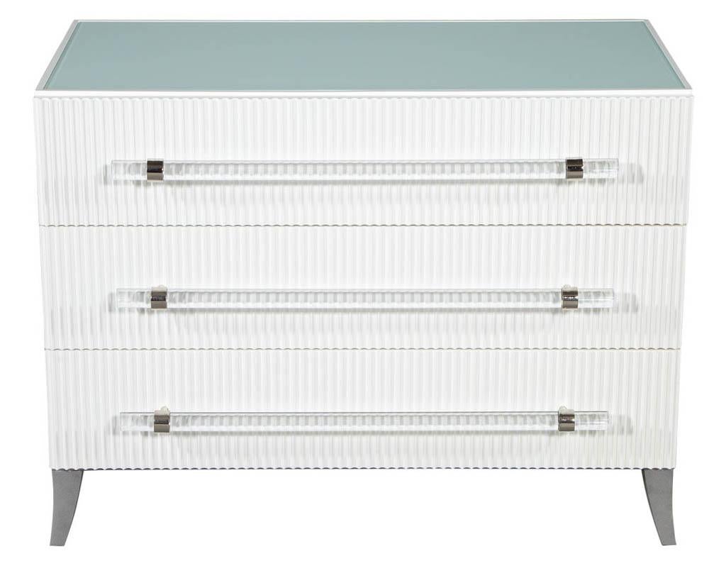 Custom modern white chests with Ribbed Facade. These transitional style chests are wonderfully fresh and intrinsically modern. Made to order right here in Canada, crafted of solid wood and finished in eggshell white with long Lucite tubular handles
