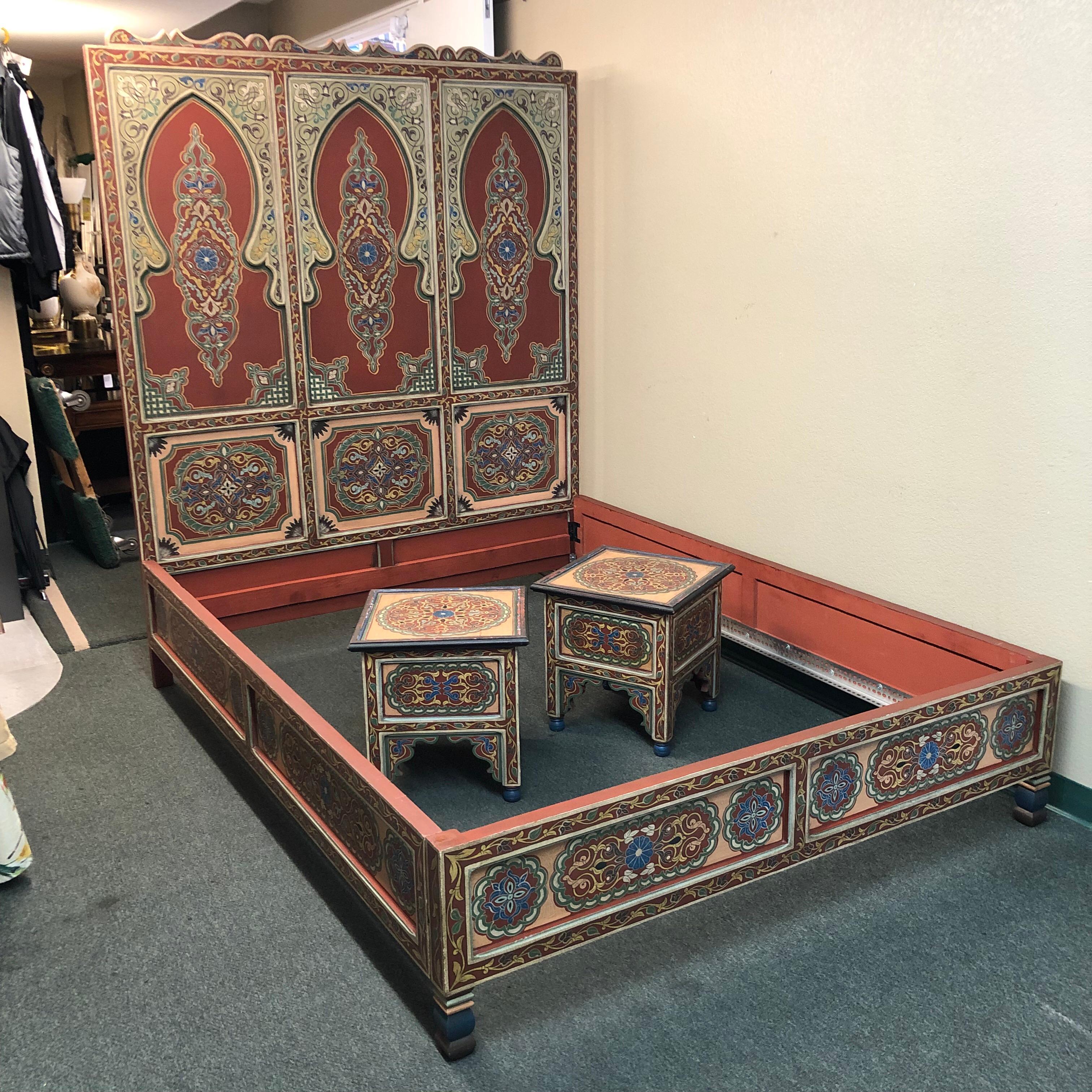 A stunning custom bedroom set, handcrafted in Morocco. Referencing traditional carved elements and rich colors of the country, the queen bed frame and pair of nightstands are an exotic delight that transports one to another time and place. Three