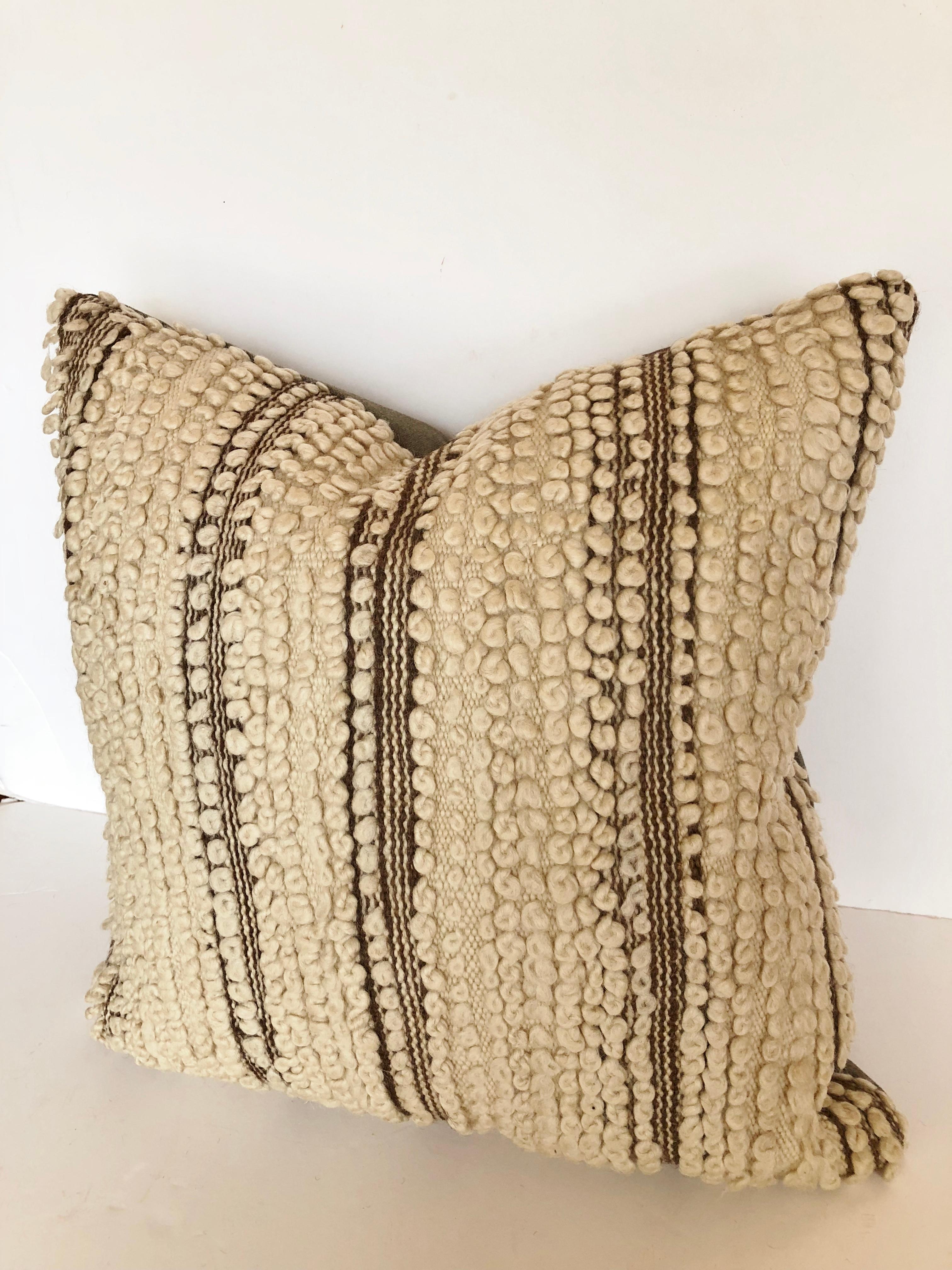 Custom pillow made from a vintage hand loomed wool Beni Ouarain rug from the Atlas Mountains. Wool is soft and lustrous with all natural color. Pillow is backed in a wool blend, filled with an insert of 50/50 down and feathers and hand sewn closed.