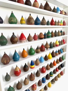 Custom Mounted Collection Of 100 Antique Child's Wooden Spinning Tops.