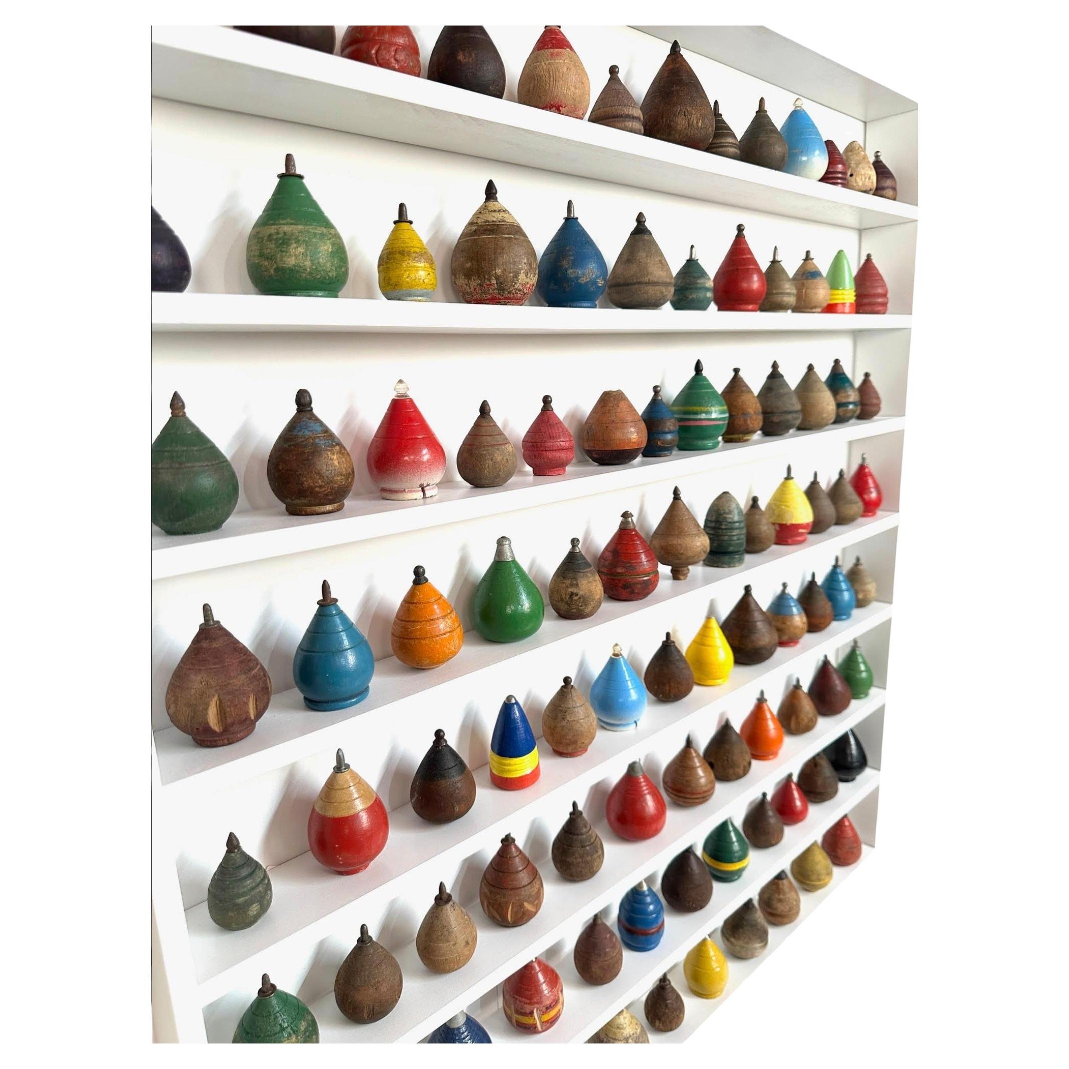 Custom Mounted Collection Of 100 Antique Child's Wooden Spinning Tops.