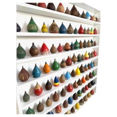 Custom Mounted Collection Of 100 Antique Child's Wooden Spinning Tops.