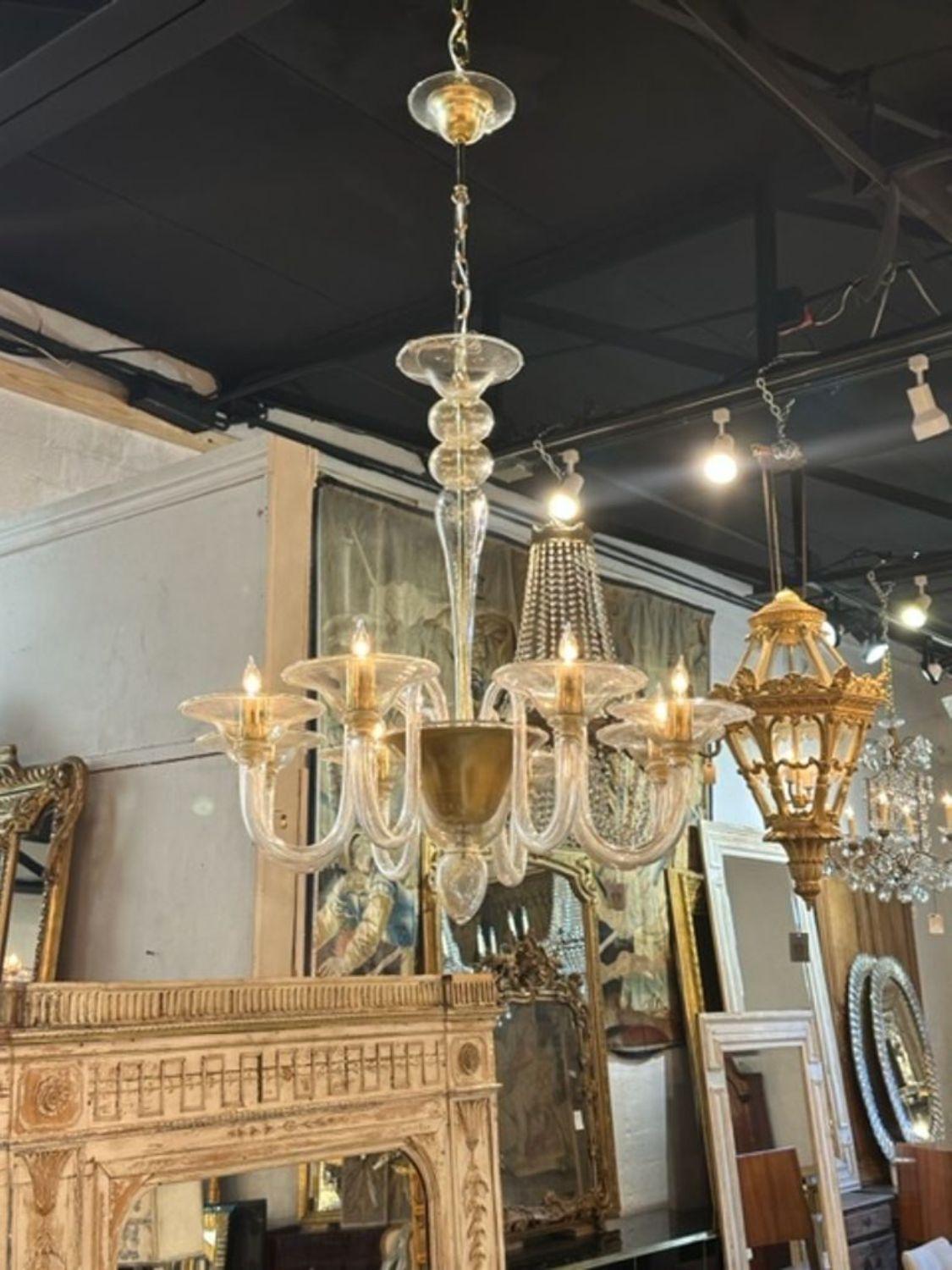 Elegant custom made gold Murano Glass chandelier. Featuring glistening glass and draping arms. Can be made in with different colors and in different sizes.  Gorgeous!
