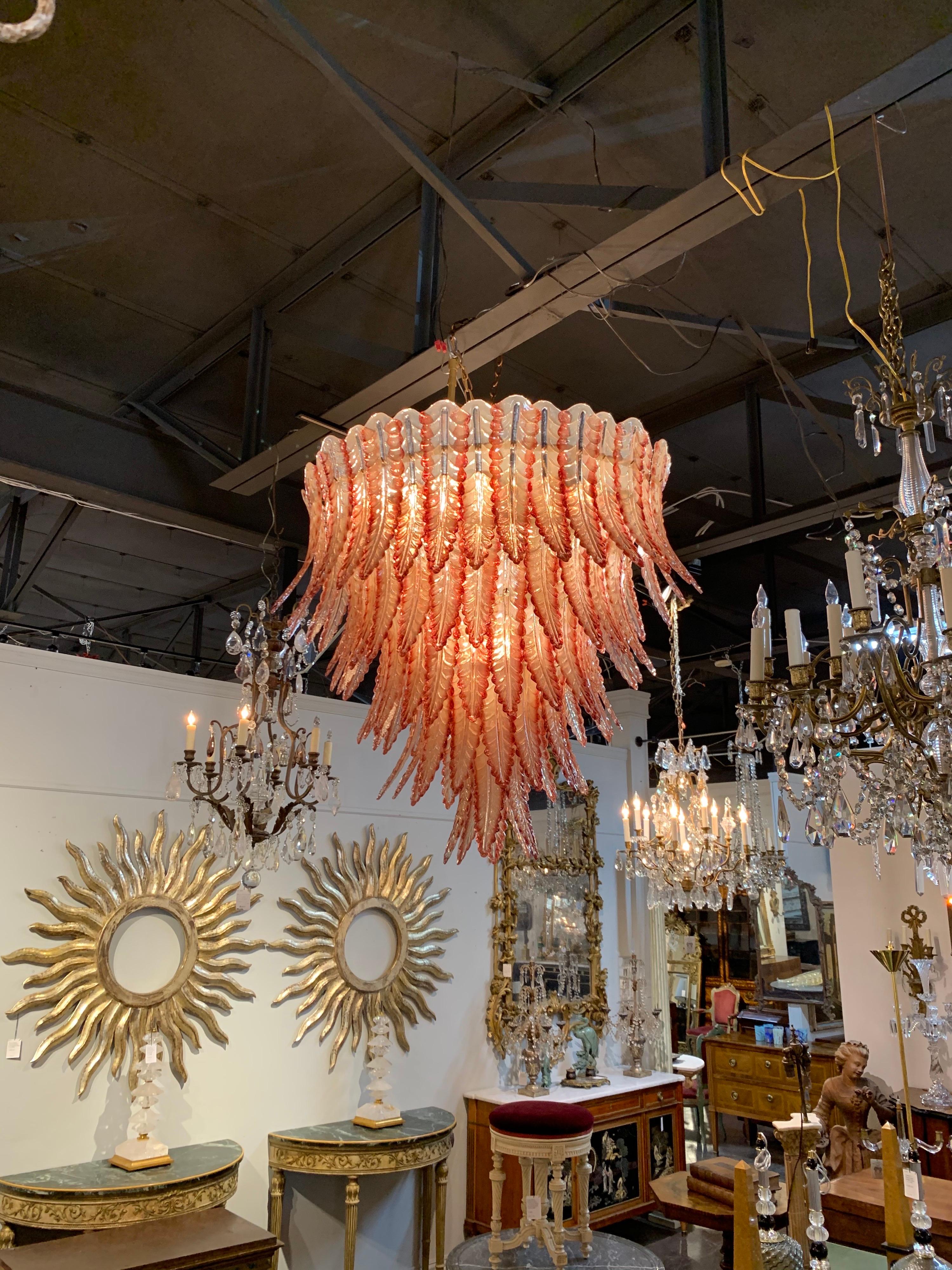Stunning custom coral colored Murano glass leaf form waterfall chandelier. Glistening glass and large scale make this fixture super impressive. A true work of art!!