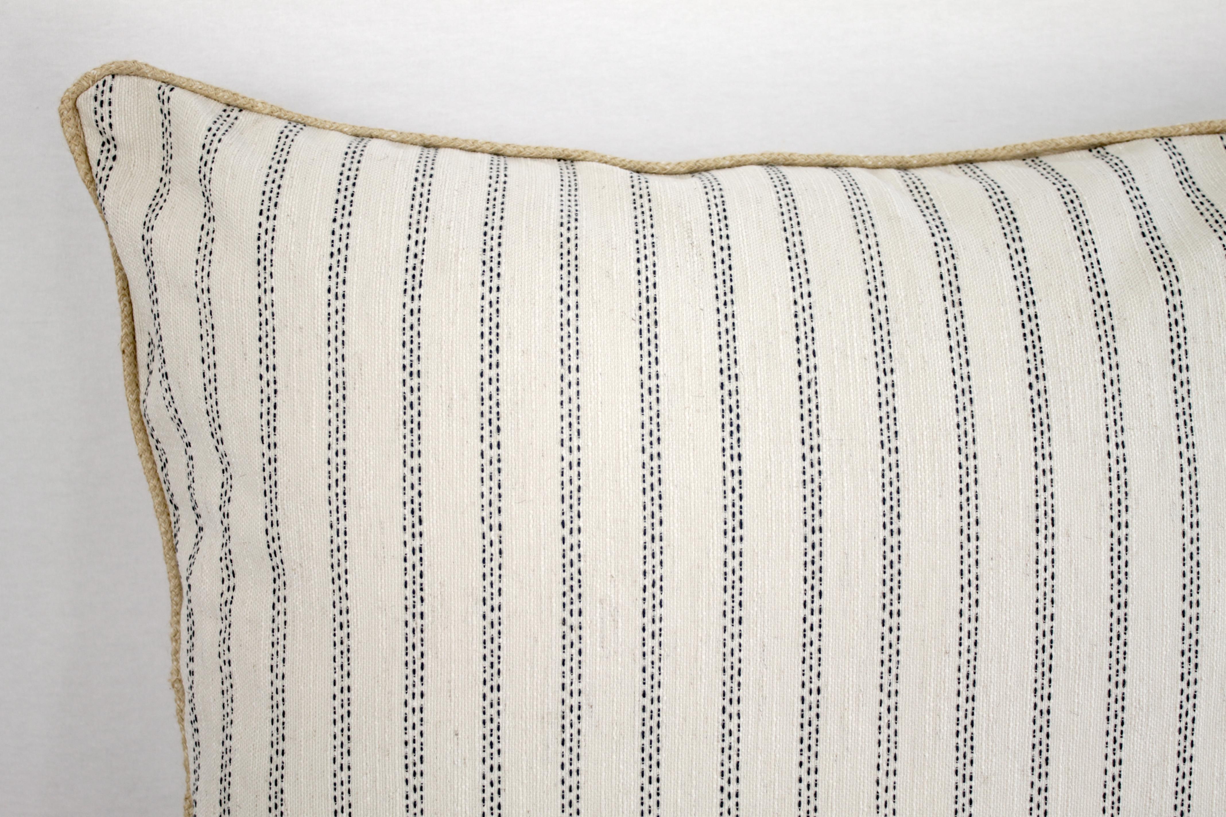 Custom natural and navy ticking stripe pillow with braided Jute cord zipper closure, machine washable. Measures: 26 x 26. No insert is included.