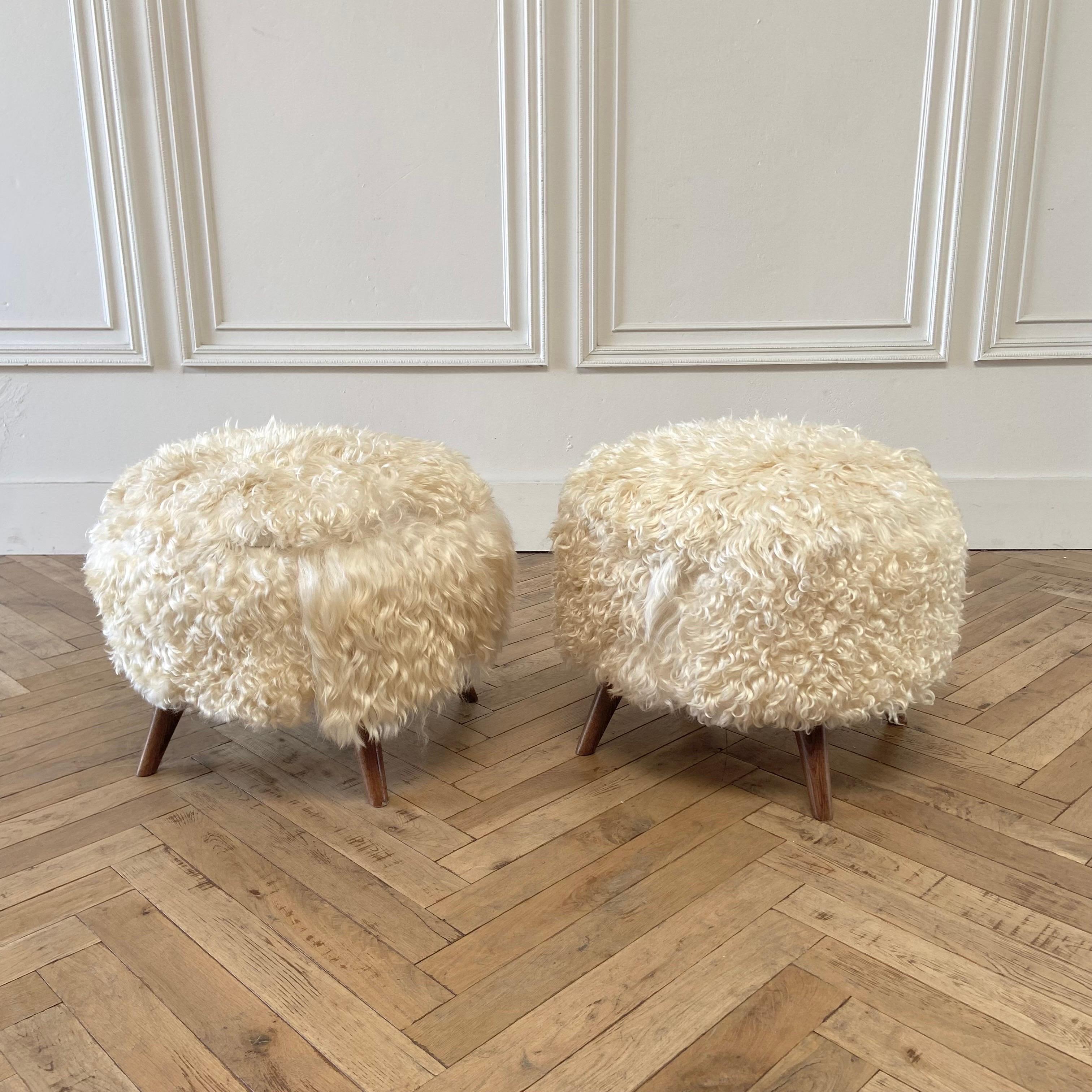 Lamb hide ottomans 
Size: 22”rd. X 18”h
Natural color, these hides have a soft curly medium-long hair. These are real natural hides, they will show different lengths of hair, and some areas may appear curlier than other areas. 
Extremely soft to