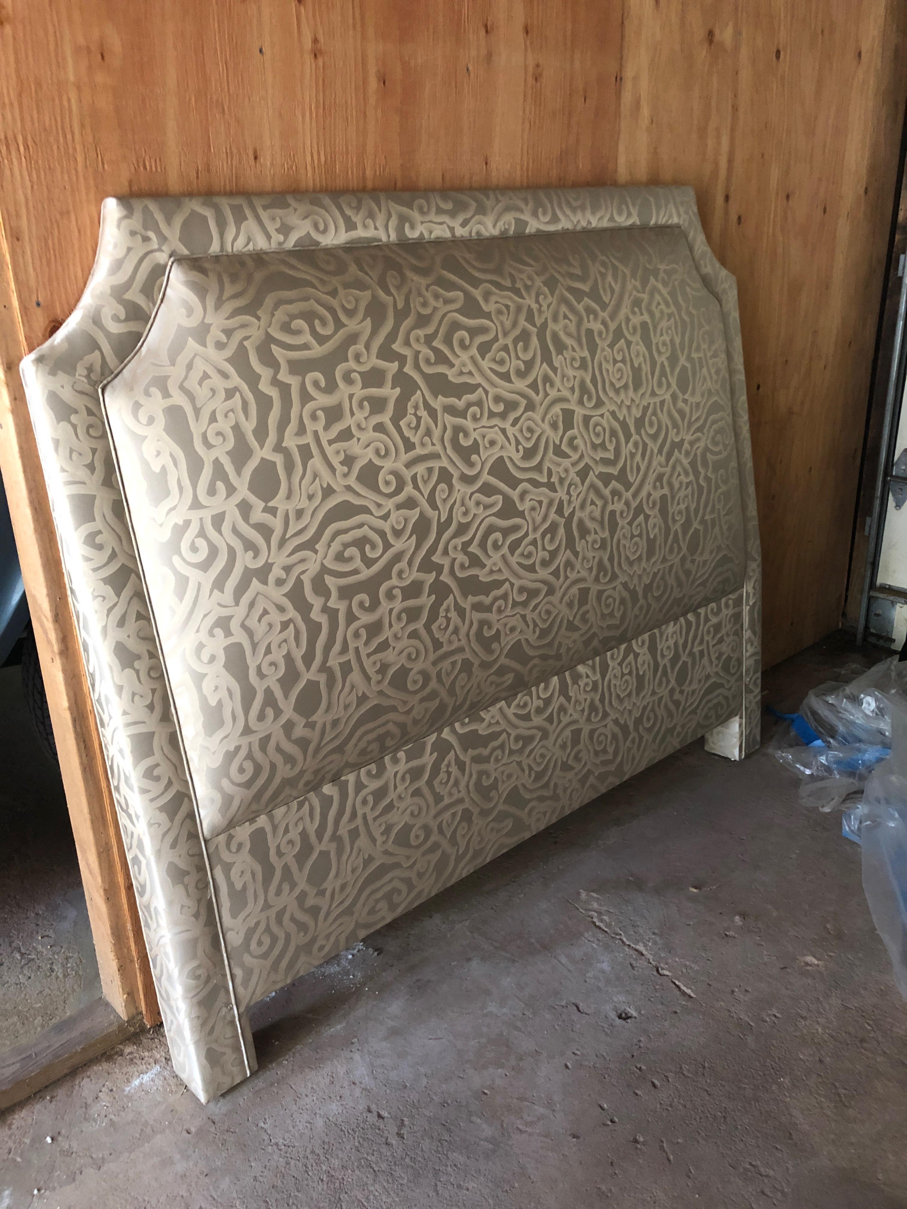 Beautiful satiny upholstered queen size headboard, never used. Material is a neutral swirly satin in taupe and beige.