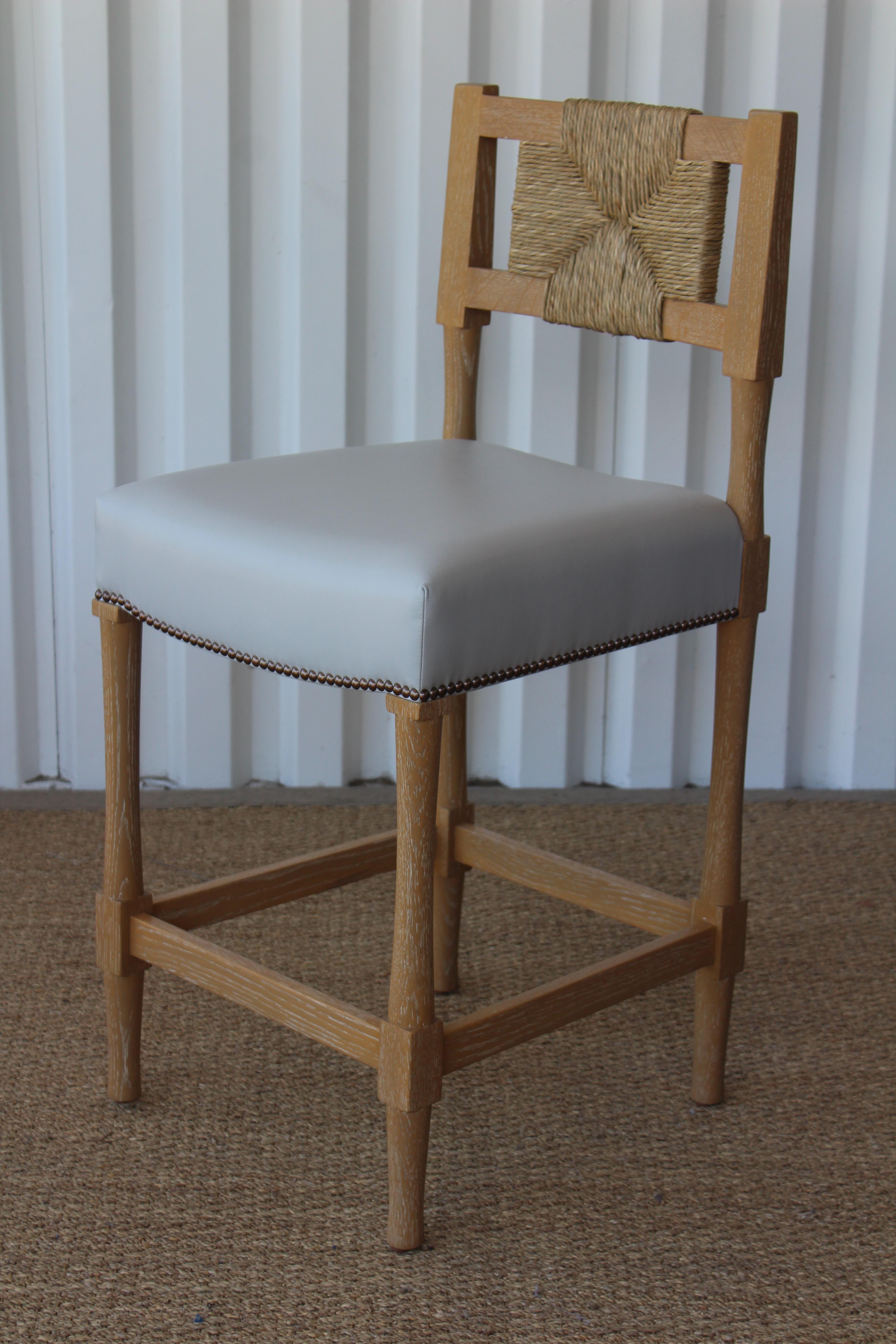 Set of four New York Athletic Club bar stools by Hollywood at Home. This New York Athletic Club barstool is a 1940s twist on an Arts & Crafts Classic: a re-edition of a chair from the Downtown New York Athletic Club. Remarkably comfortable, the