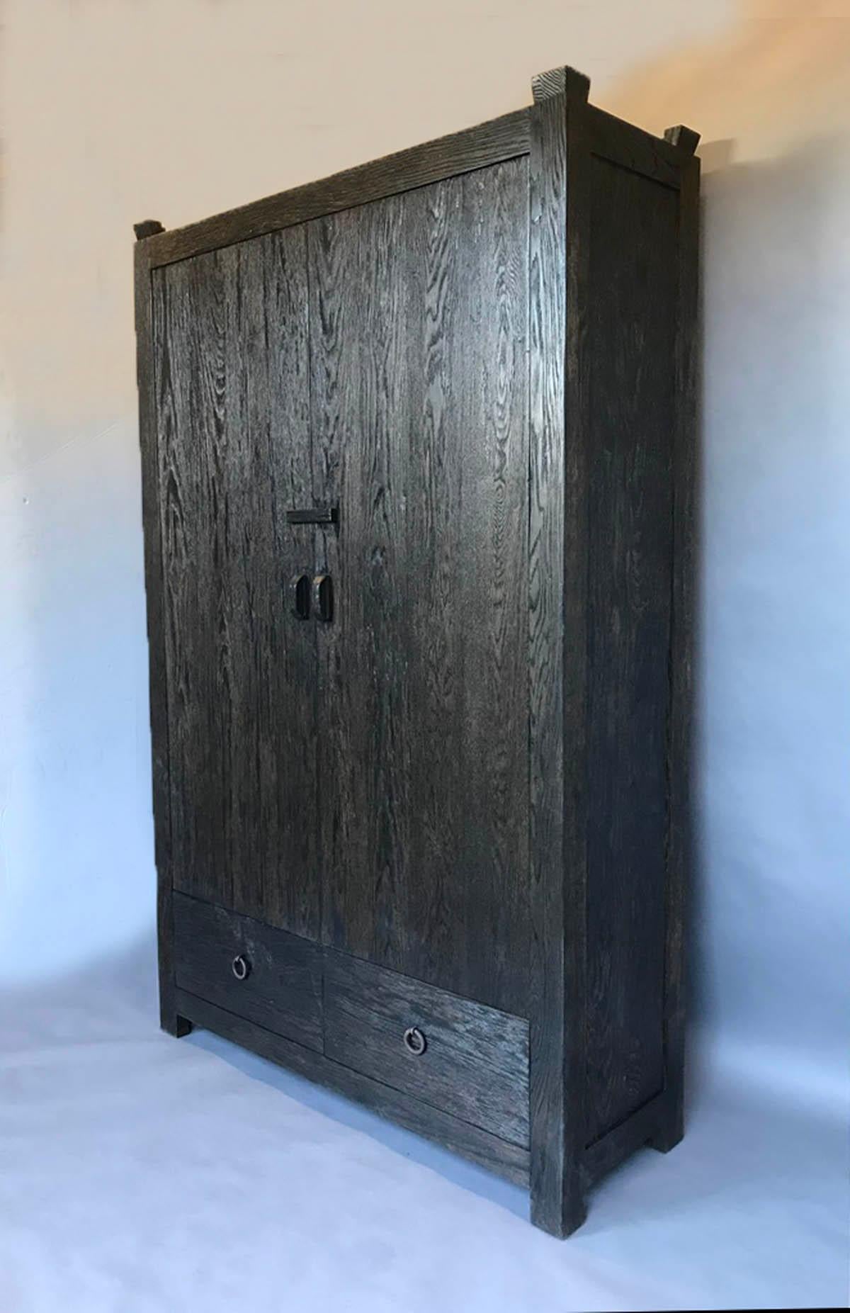 Custom oak cabinet with pocket doors and two large drawers. This cabinet is made to client's specifications and can be made in any size, configuration and finish, with regular doors or pocket doors. Shown here with an open grain and distressed