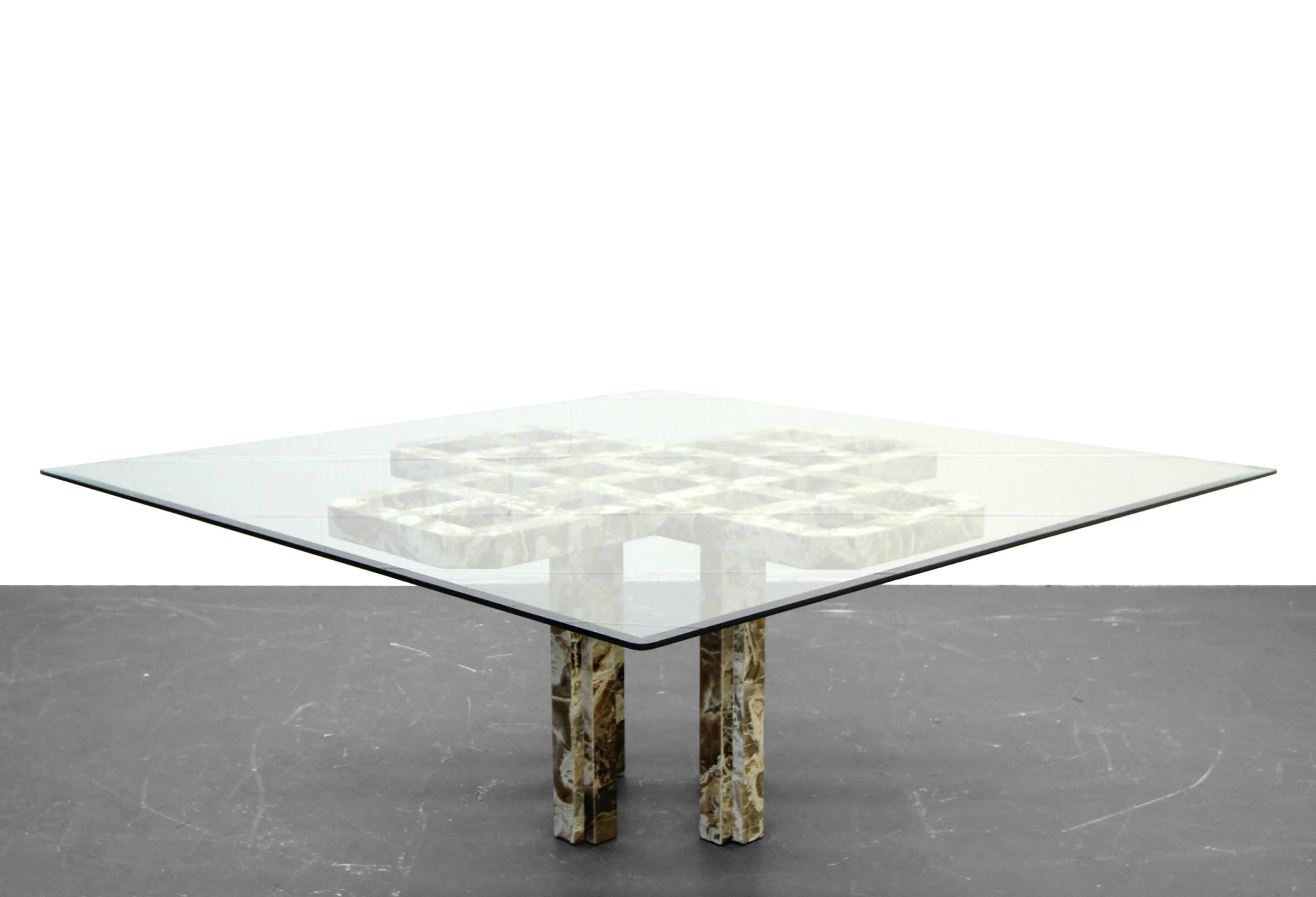 Beautiful custom onyx dining table. Very intricate, beautiful piece, perhaps one of a kind. Lattice designed top and 4 legs constructed of caramel and cream onyx in the shape of an X or a T depending on how you view it. This is a massive piece that