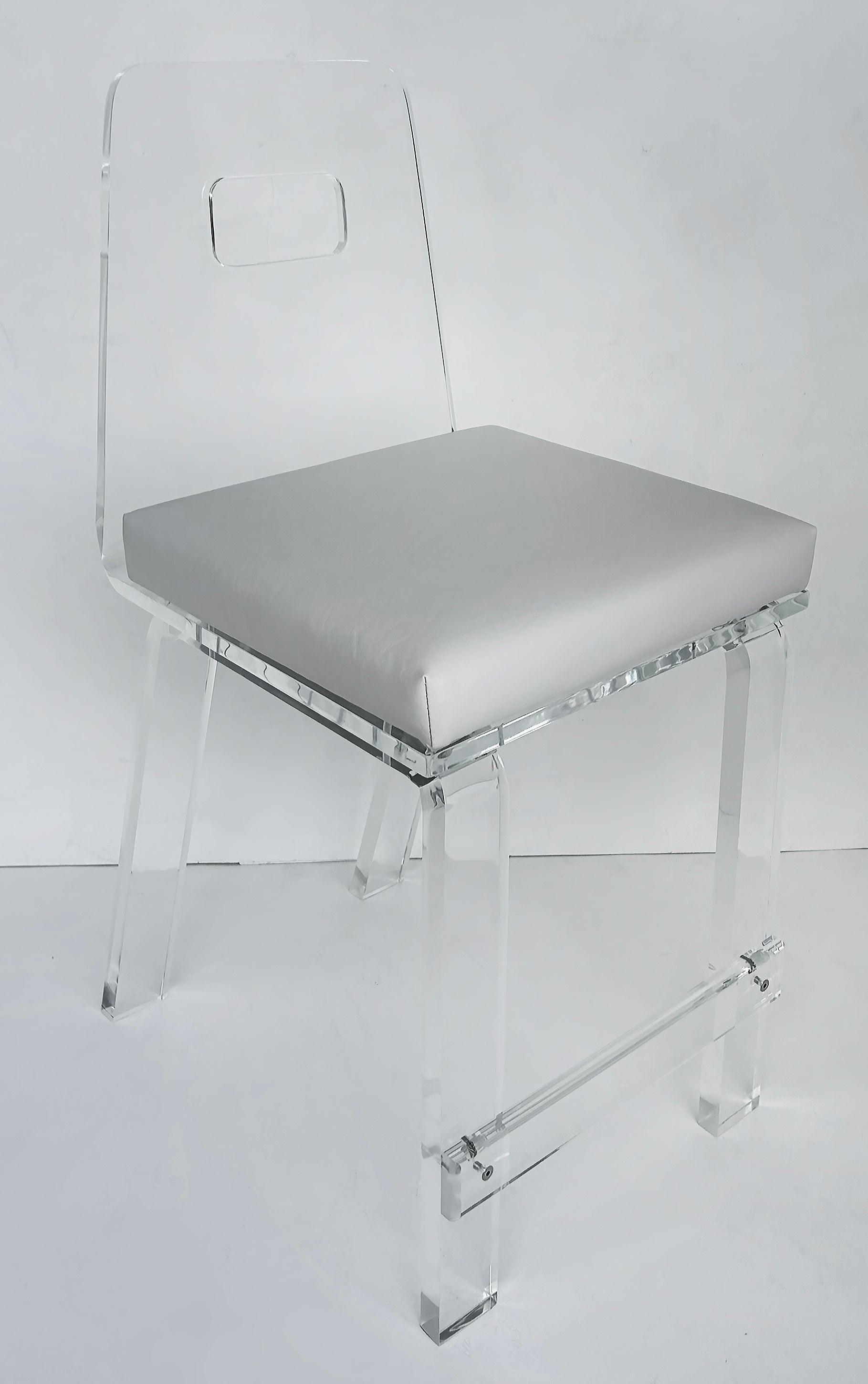 Custom Made Lucite Bar or Counter Stool with Upholstered Seat, Made to Order

Offered for sale is a custom made Lucite counter height bar stool  with an upholstered seat cushion.  The chair itself is 3/4