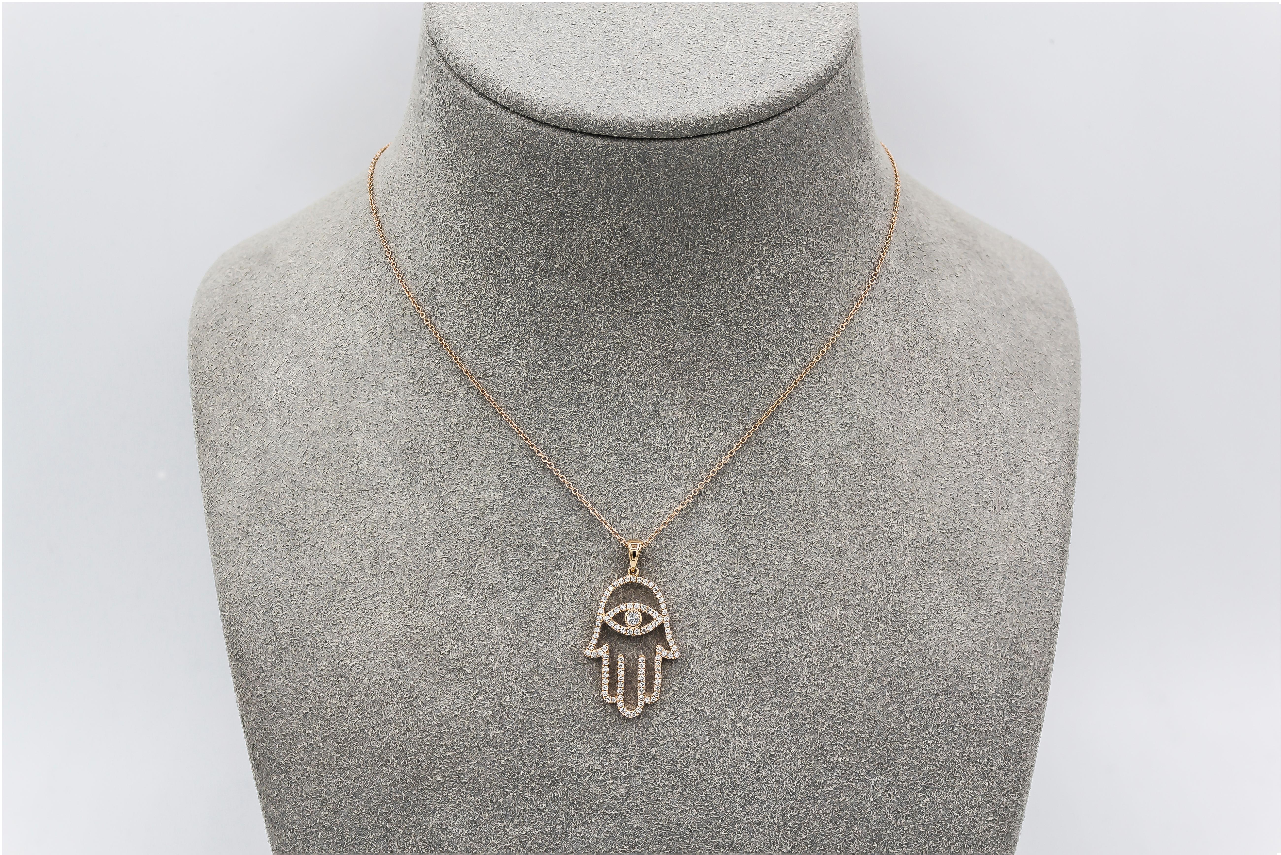 Custom Handcrafted Hamsa Hand Pendant Necklace
Made in 18 karat yellow gold.
Set with a garnet center accented with round brilliant diamonds.
No Chain.
Approximately 4-6 weeks to make.