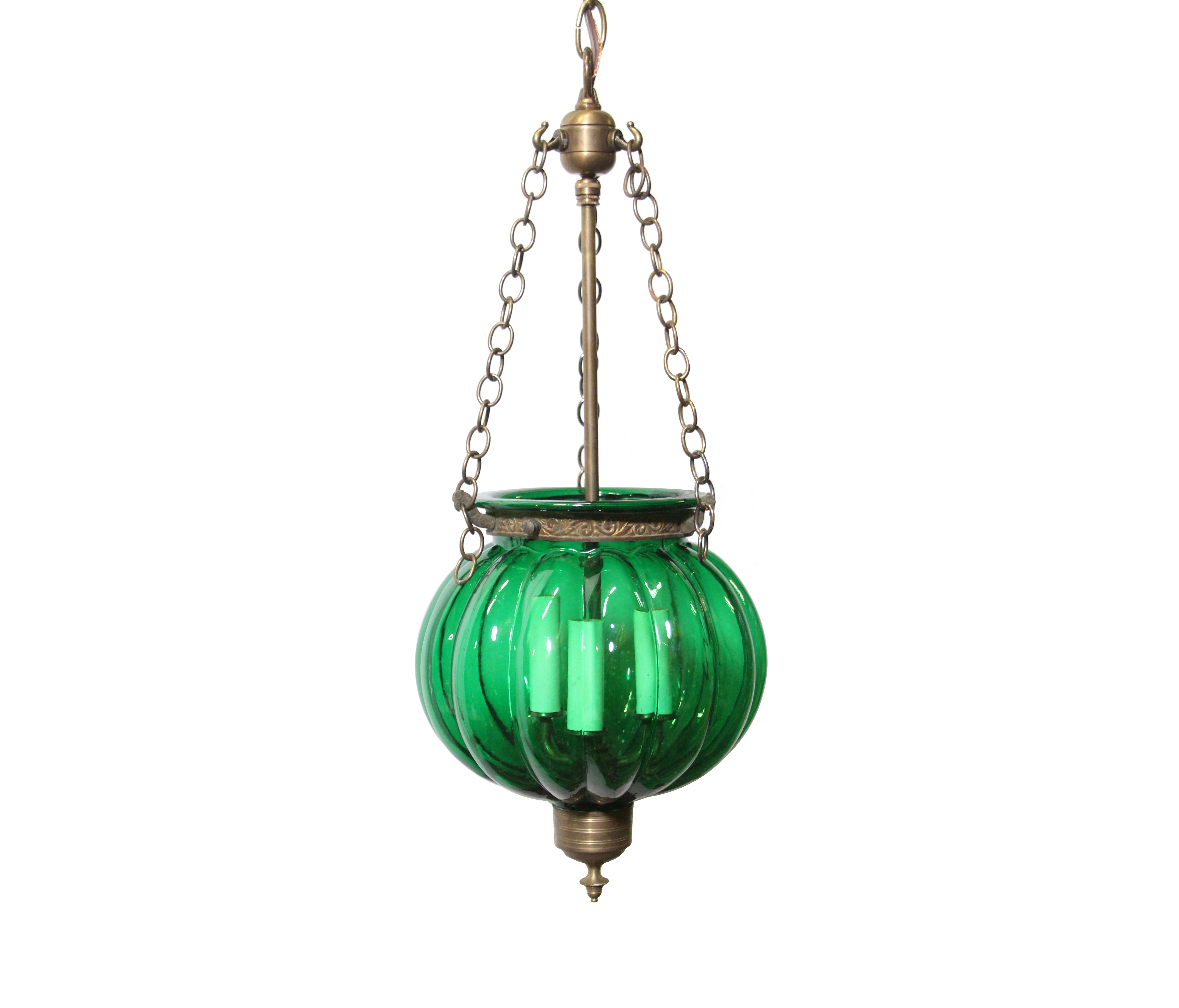 Custom order for Theresa. This five piece set consists of three early 20th century antique original hand blown green glass bell jar pendant lights of the 