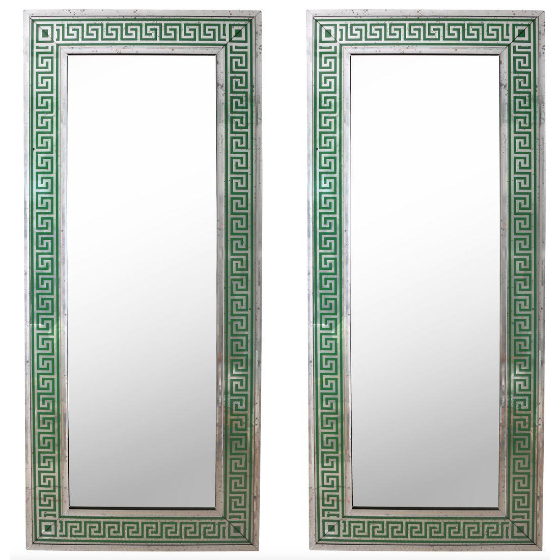 This custom oversized rectangular mirror features a striking green frame adorned with a classic Greek key pattern, symbolizing timeless elegance and geometric precision. The bold, intricate design of the frame adds a sophisticated touch, while the