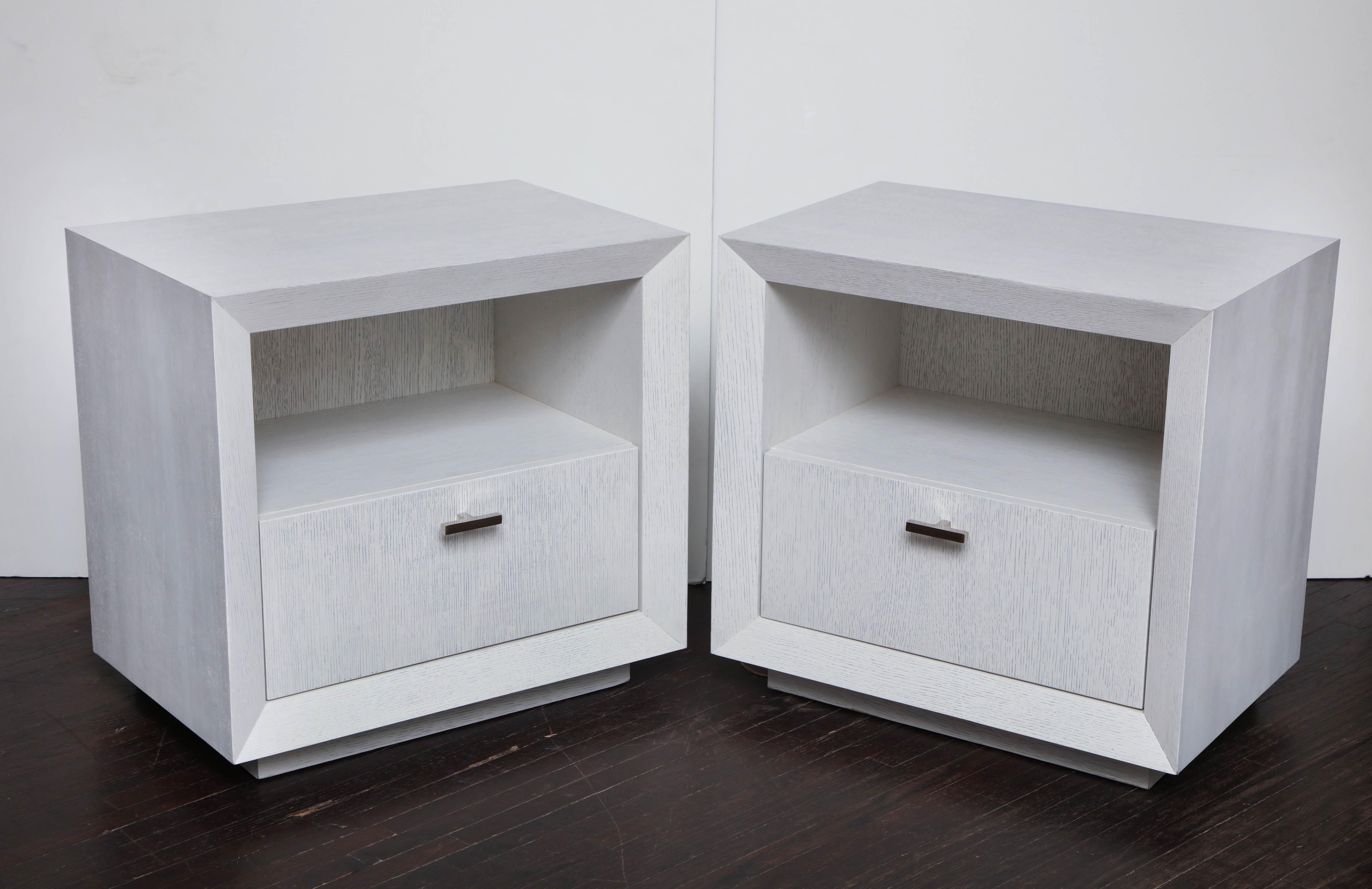 Pair of custom painted cerused wood nightstands with polished nickel pull. The drawer interior finish is shown in maple. Customization is available in different sizes, colors, interior finish, and hardware (Customer Owned Hardware).