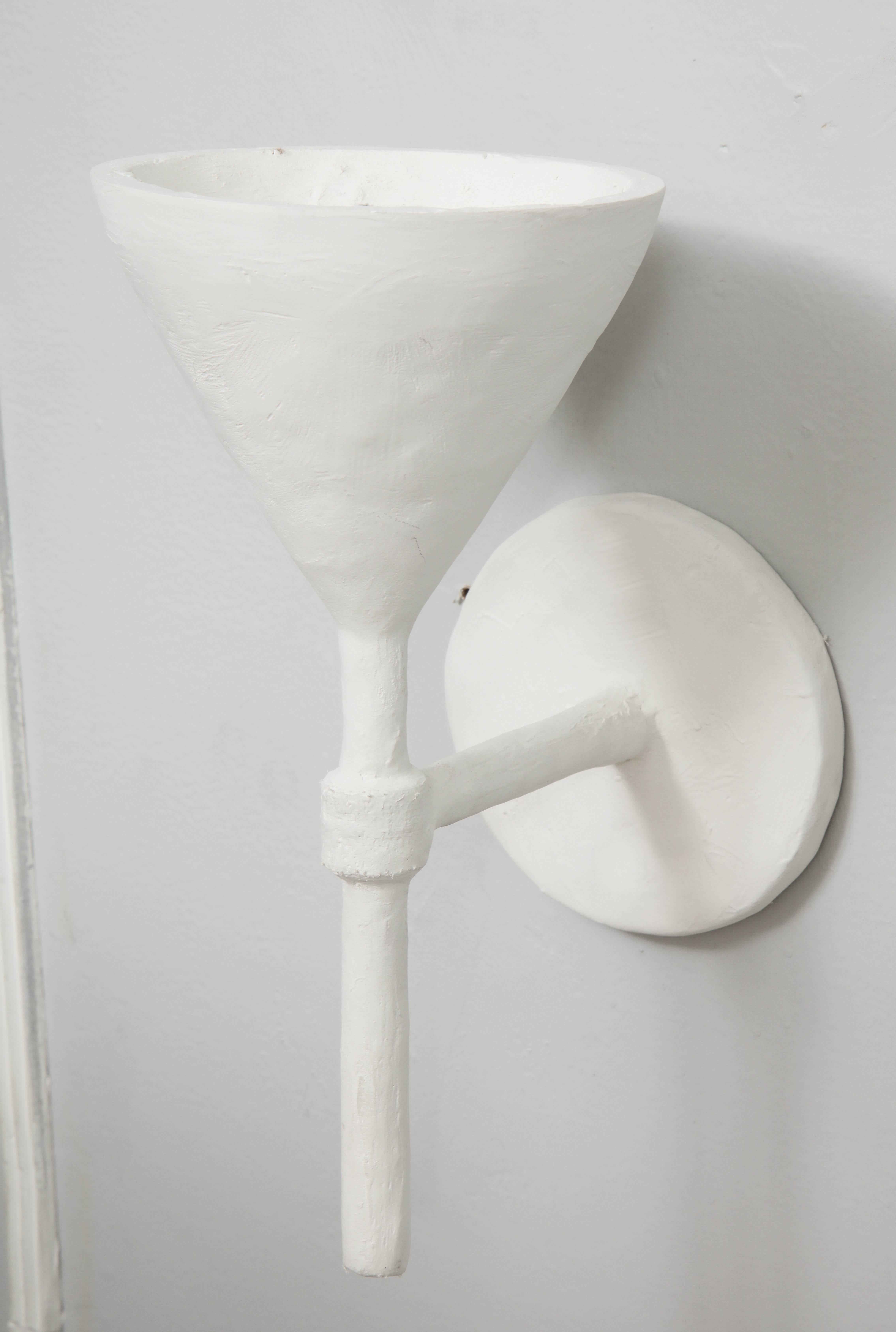 white plaster wall sconce