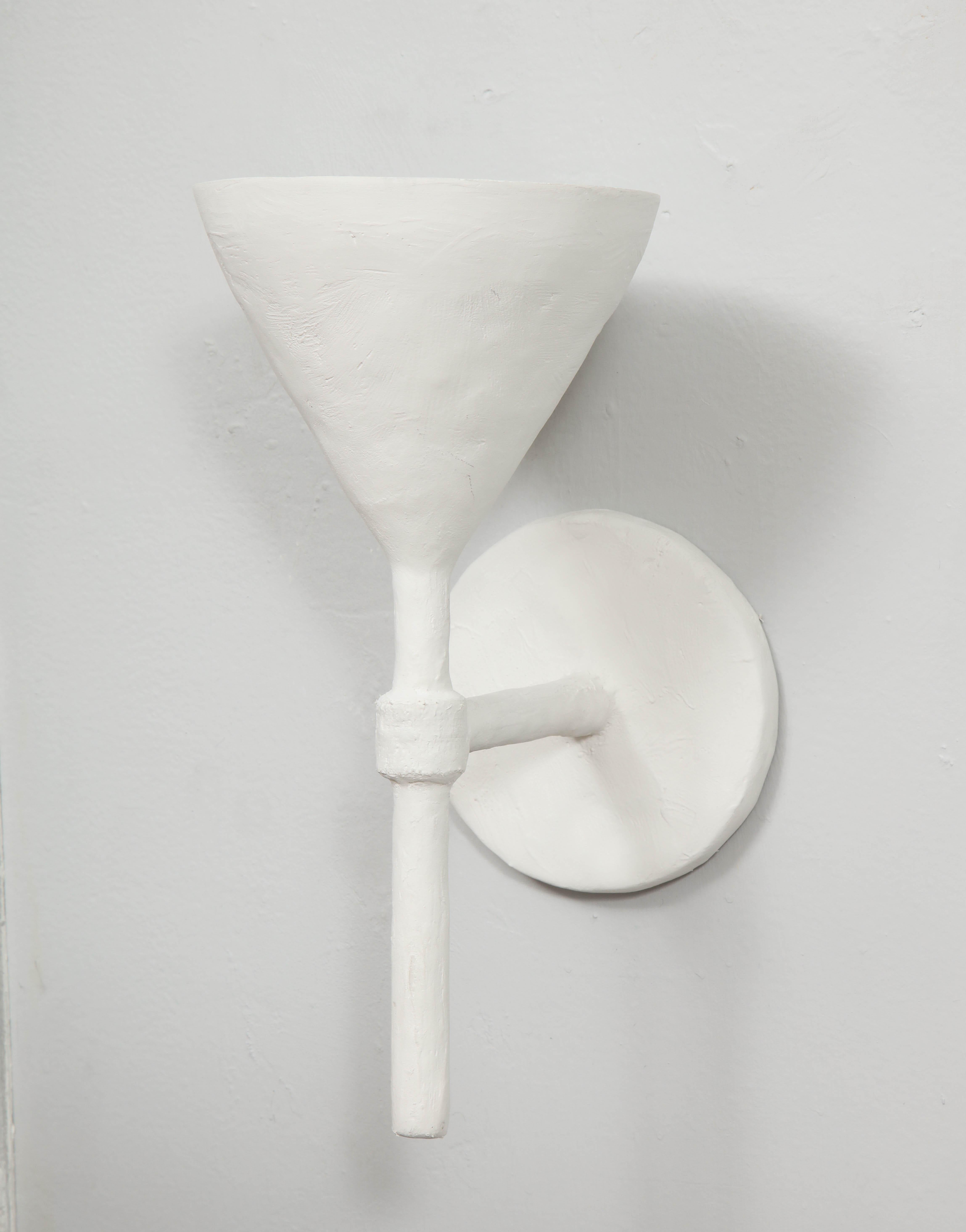 white plaster sconces