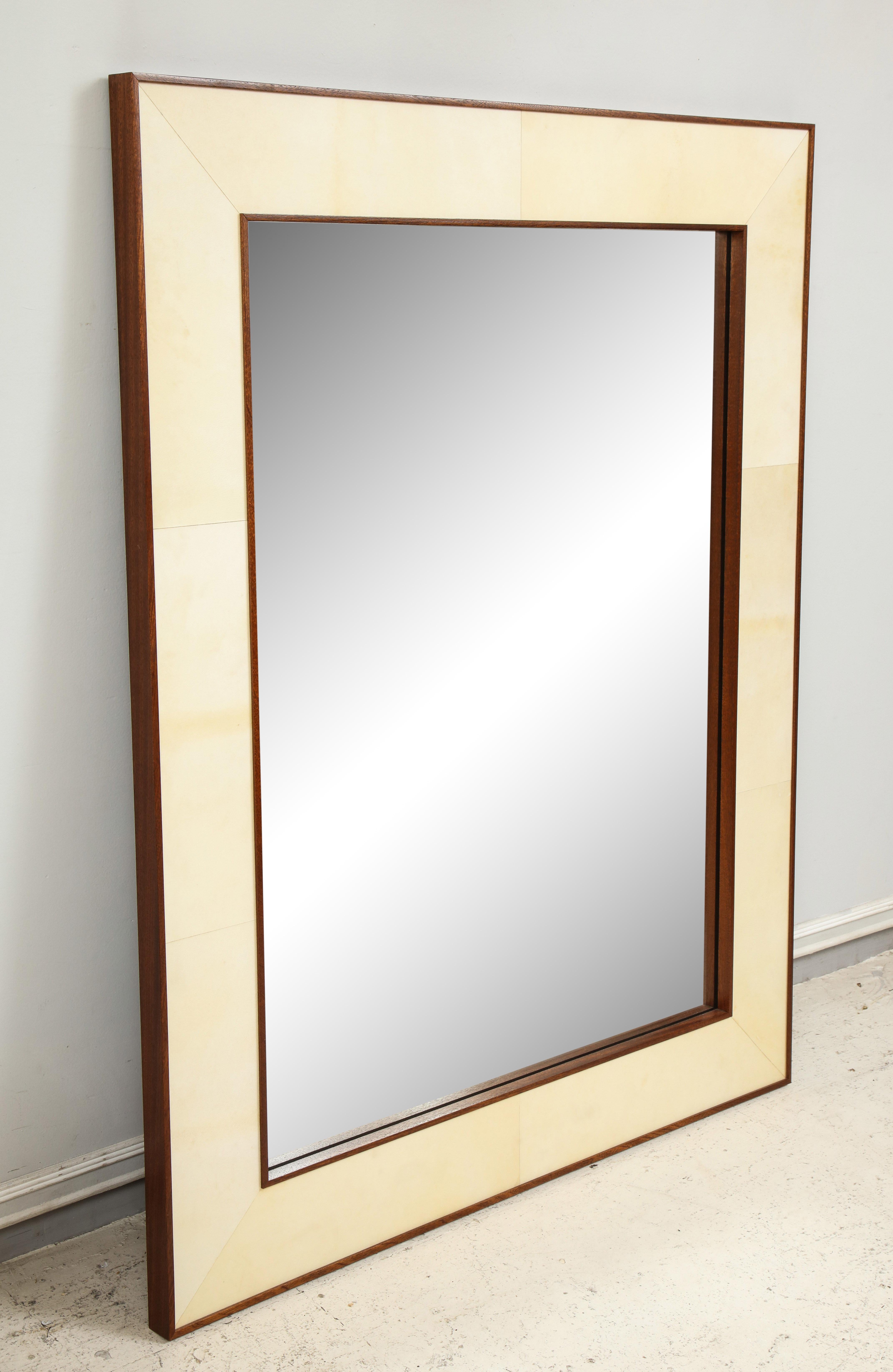Custom parchment mirror with mahogany frame. 
Please note that this mirror is customizable.
Lead Time is 8-10 weeks for a custom order.