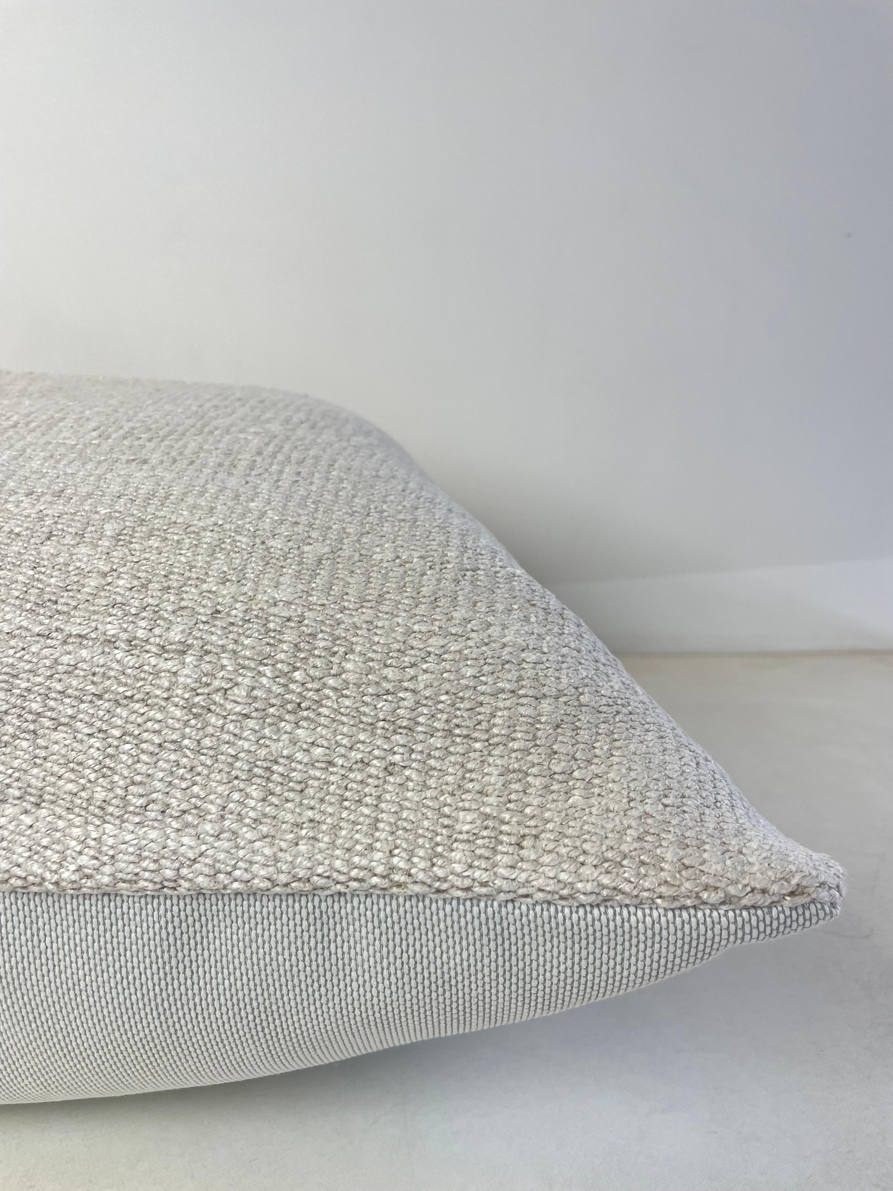 Creamy white hemp rug patchwork style pillow. Unique patchwork pillow has been made with parts of different Turkish rugs, in multiple white tones. Solid fabric backing, and hidden zipper closure. Spot cleaning is recommended, or dry clean. These