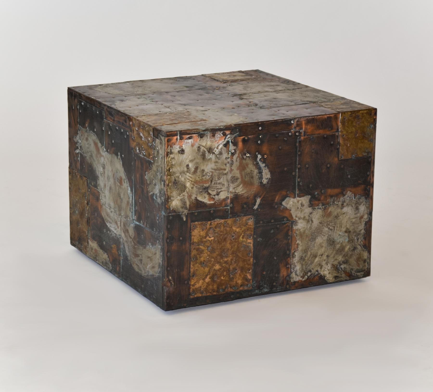 Paul Evans For Directional Metal Patchwork Cube Side Table 1967
Steel, copper and brass patchwork metal cube table by Paul Evans. Seldom seen without a slate inset. 
The table features Evans signature nailed, hand-distressed and tooled copper sheets
