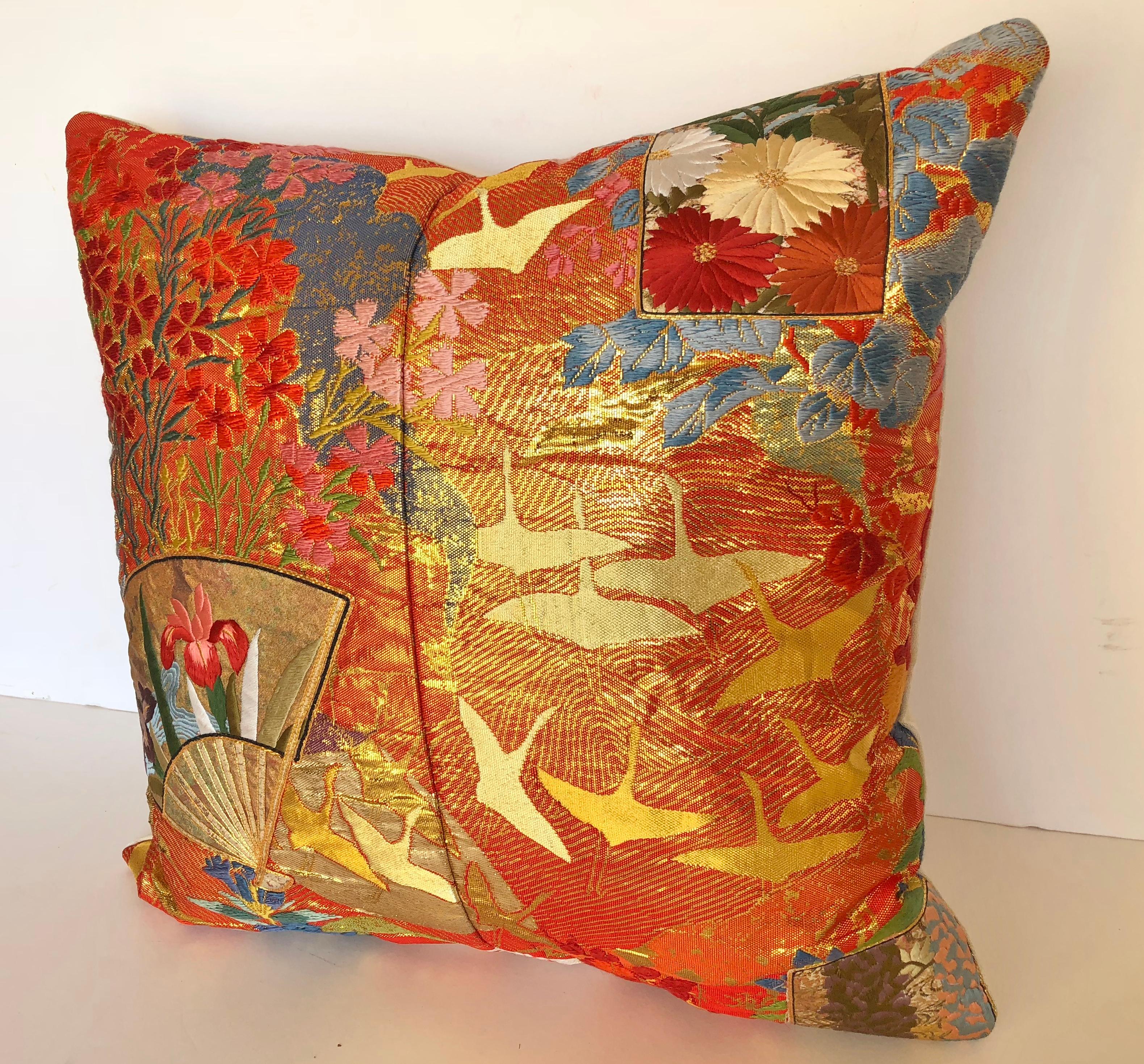 Custom pillow cut from a vintage silk Japanese Uchikake, the traditional wedding kimono. The silk is embellished with florals and birds in metallic threads and silk appliques of fans and flowers. The pillow is backed with a silk/linen Scalamandre