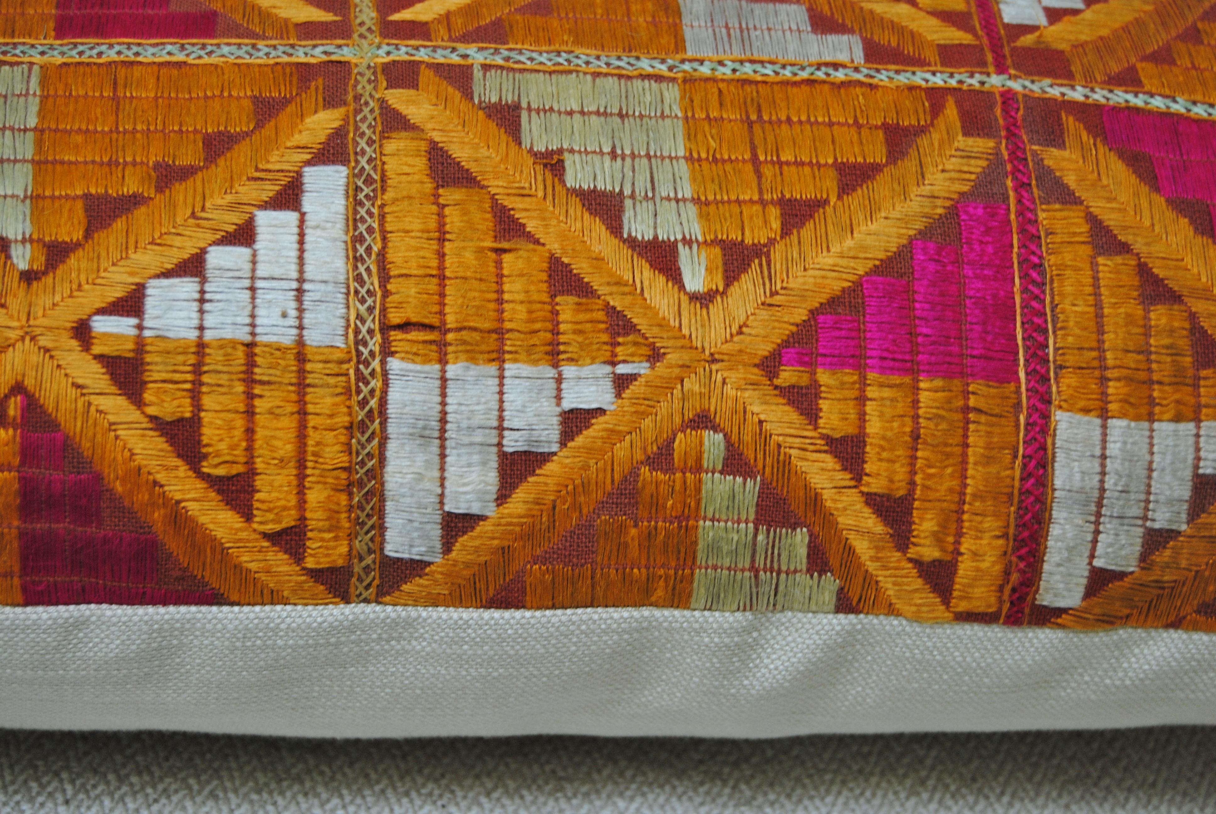 Custom pillow cut from a vintage Phulkari Bagh wedding shawl from Punjab, India. The hand loomed cotton khadi cloth shawl is hand embroidered with vibrant silk threads by relatives of the young girl for her wedding and other special occasions. The
