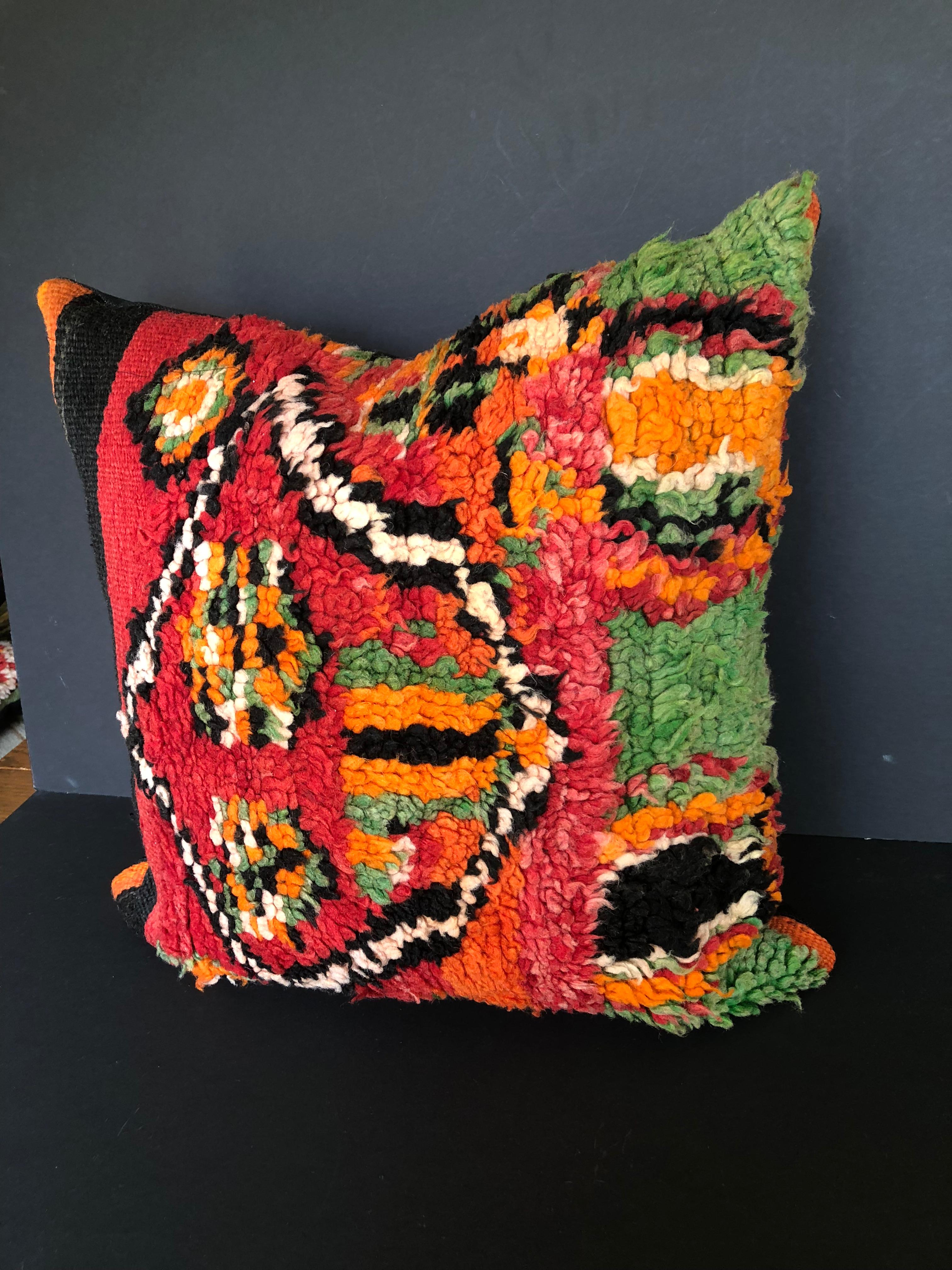 Custom pillow cut from a vintage hand loomed wool Moroccan Ait Bou Ichaouen Berber rug, one of the most remote, isolated tribes in Morocco. Bold, striking colors and patterns reflect an older North African tradition unlike those from elsewhere. The