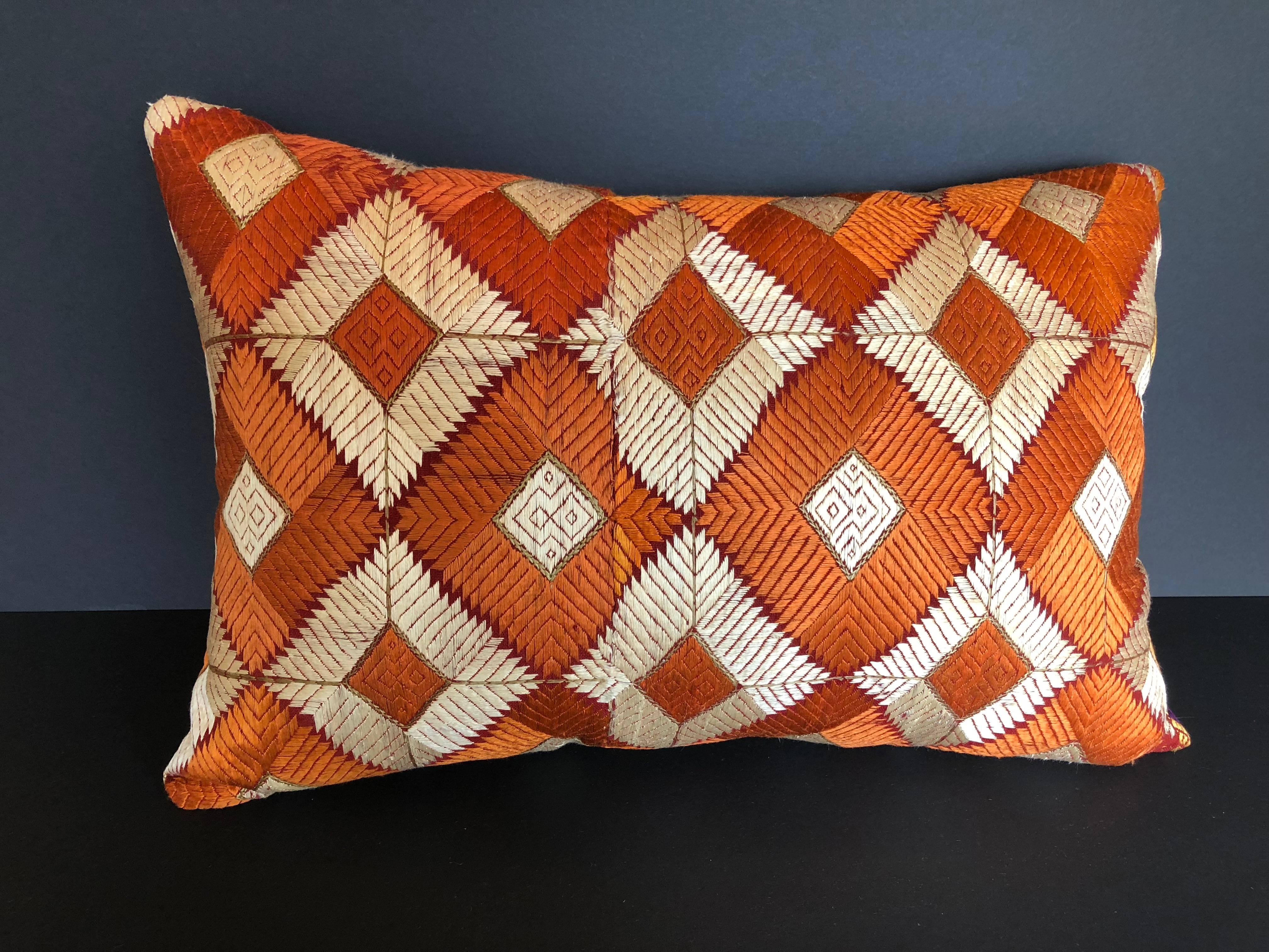 Custom pillow cut from a vintage phulkari bagh wedding shawl from Punjab, India. Hand loomed cotton Khadi cloth is hand embroidered with vibrant silk threads. The shawl is made by the relatives of the young bride and worn at her wedding and other