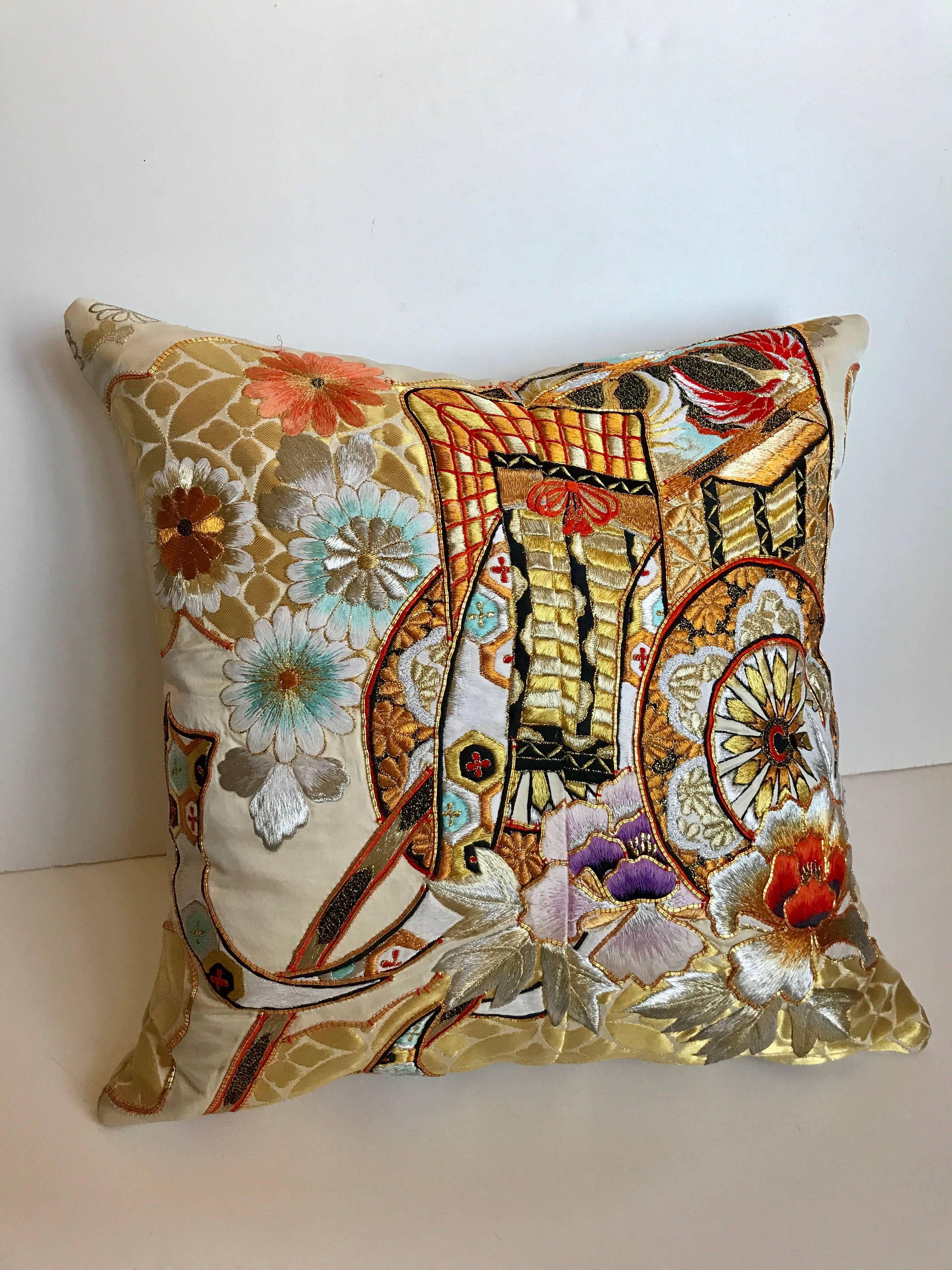 Custom pillow cut from a vintage Japanese silk Uchikake, the traditional wedding kimono. The silk is embroidered in silk and metallic threads with the design of the royal cart. The pillow is backed in an ivory silk/linen Scalamandre textile, filled