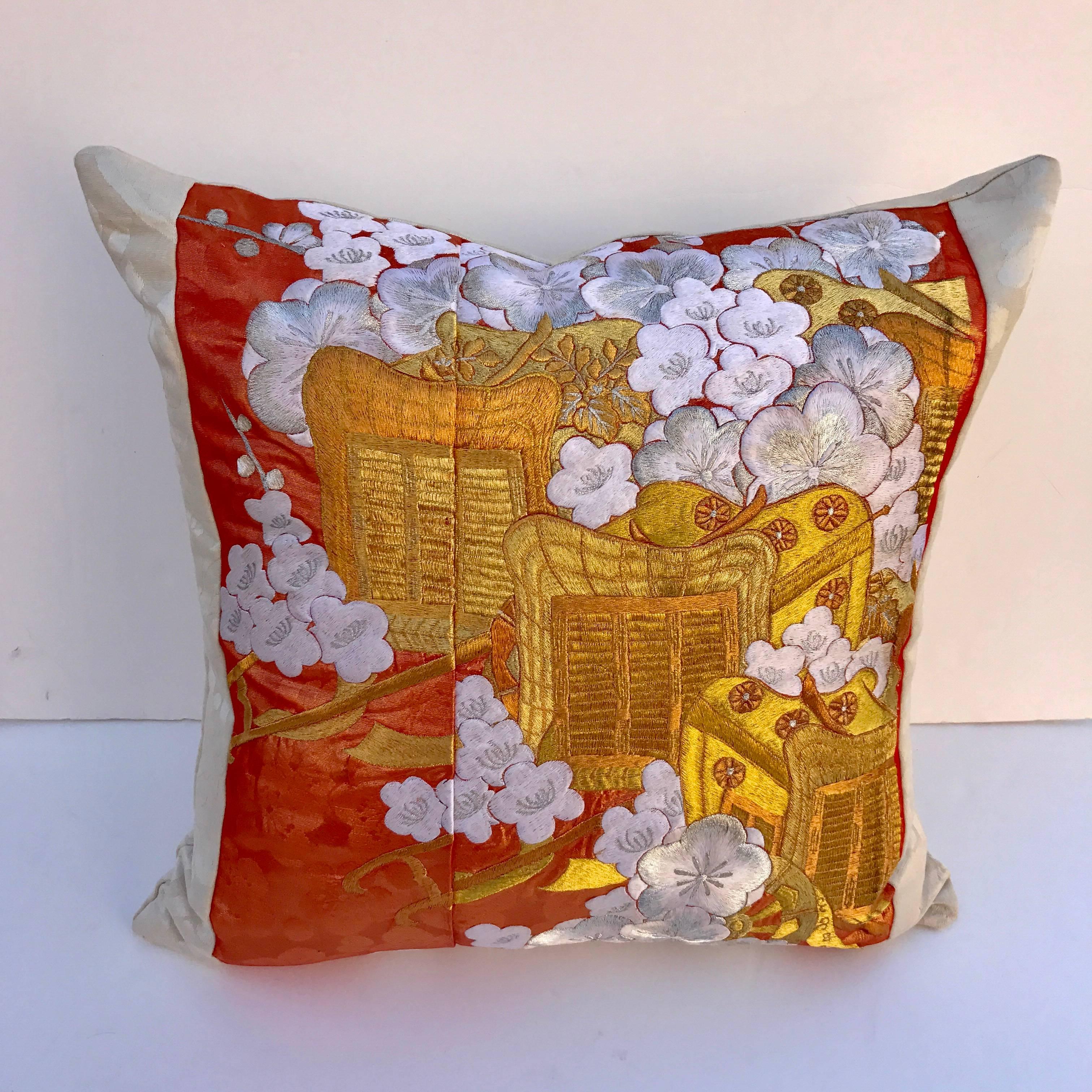 Custom pillow cut from a vintage Japanese silk Uchikake, the traditional wedding kimono. The silk panel has a gorgeous design of the royal cart with flowers embroidered with silk and metallic threads. It is faced and backed with a Scalamandre