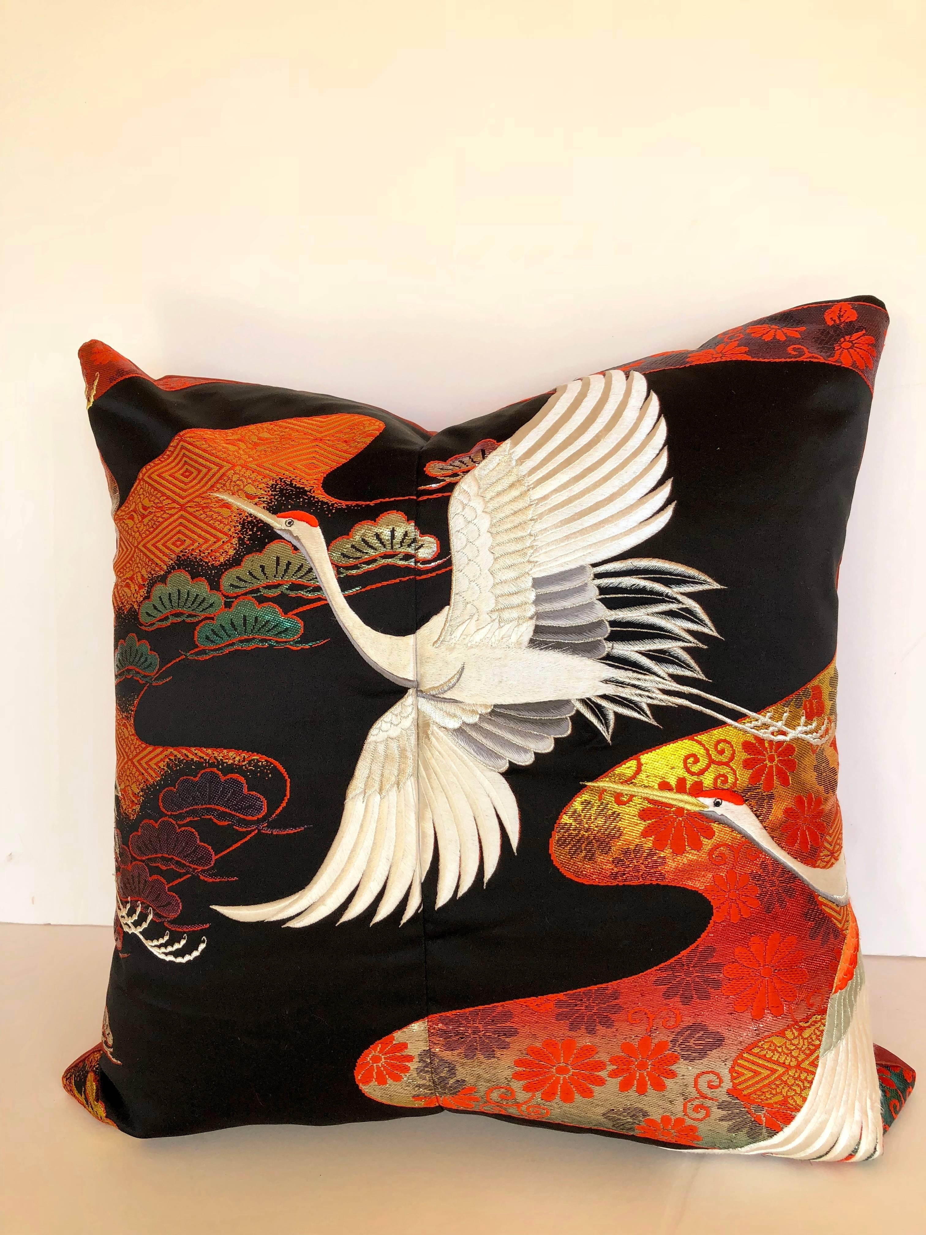 Custom pillow cut from a vintage Japanese silk Uchikake, the traditional wedding kimono. The silk is woven with vibrant designs and silk embroidered birds. The pillow is backed in silk, filled with an insert of 50/50 down and feathers and hand-sewn