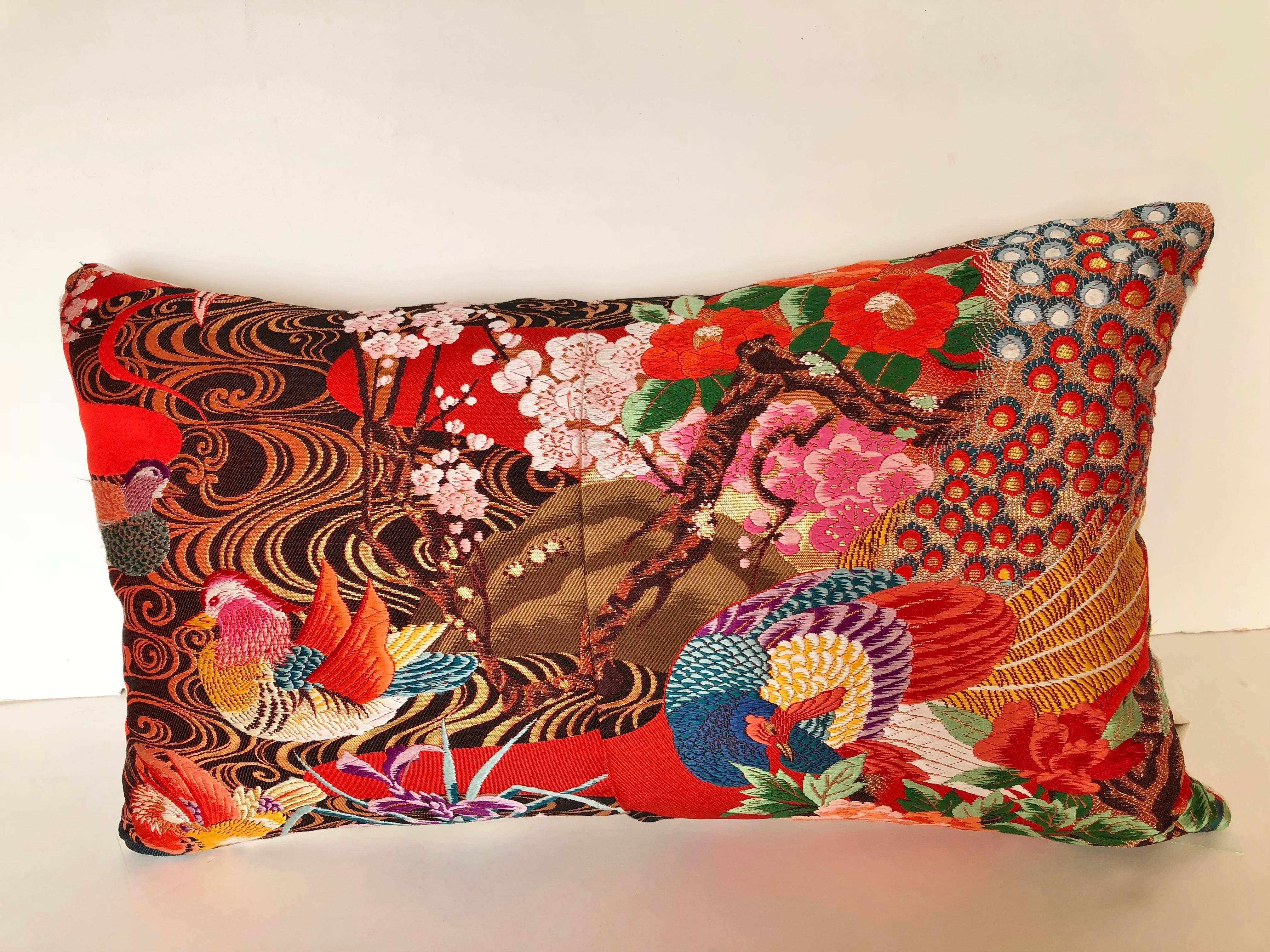 Custom pillow cut from a vintage Japanese silk Uchikake, the traditional wedding kimono. The silk has designs with the traditional Japanese florals and birds in vibrant colors. The pillow is backed in an ivory silk/linen Scalamandre textile, filled