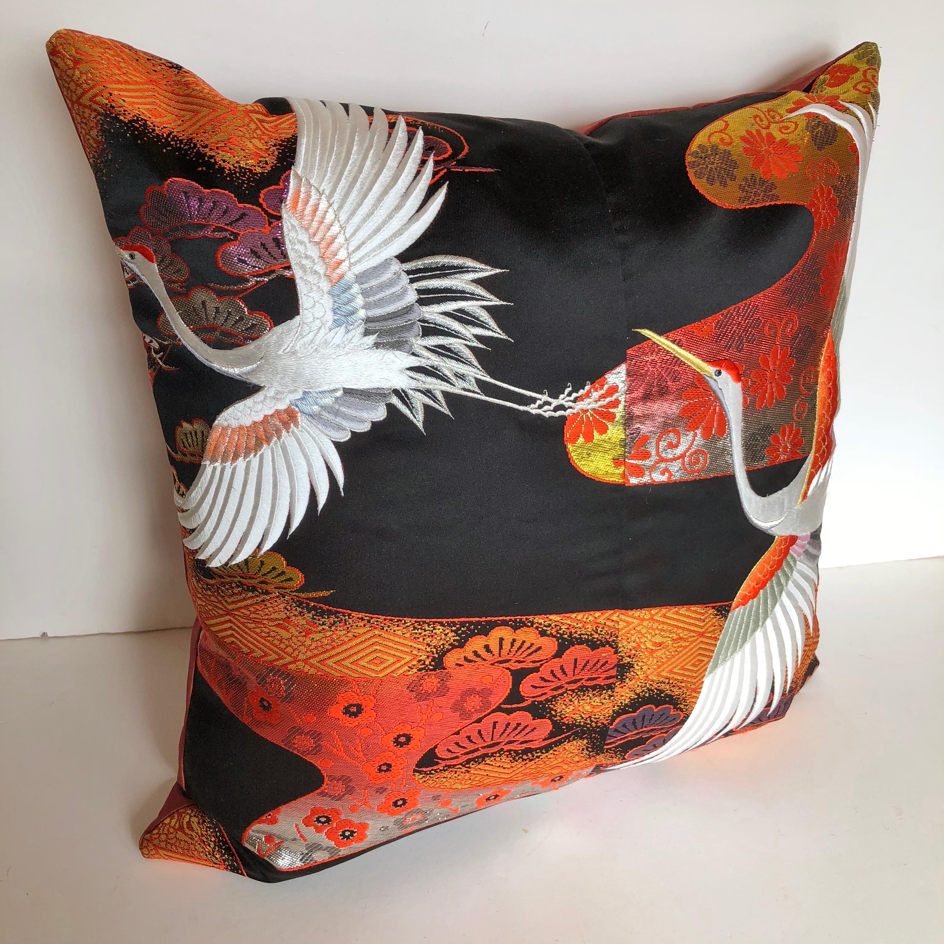 Custom pillow cut from a vintage Japanese silk Uchikake, the traditional wedding kimono. The silk textile has traditional designs with embroidered white cranes. The pillow is backed in silk, filled with an insert of 50/50 down and feathers and hand
