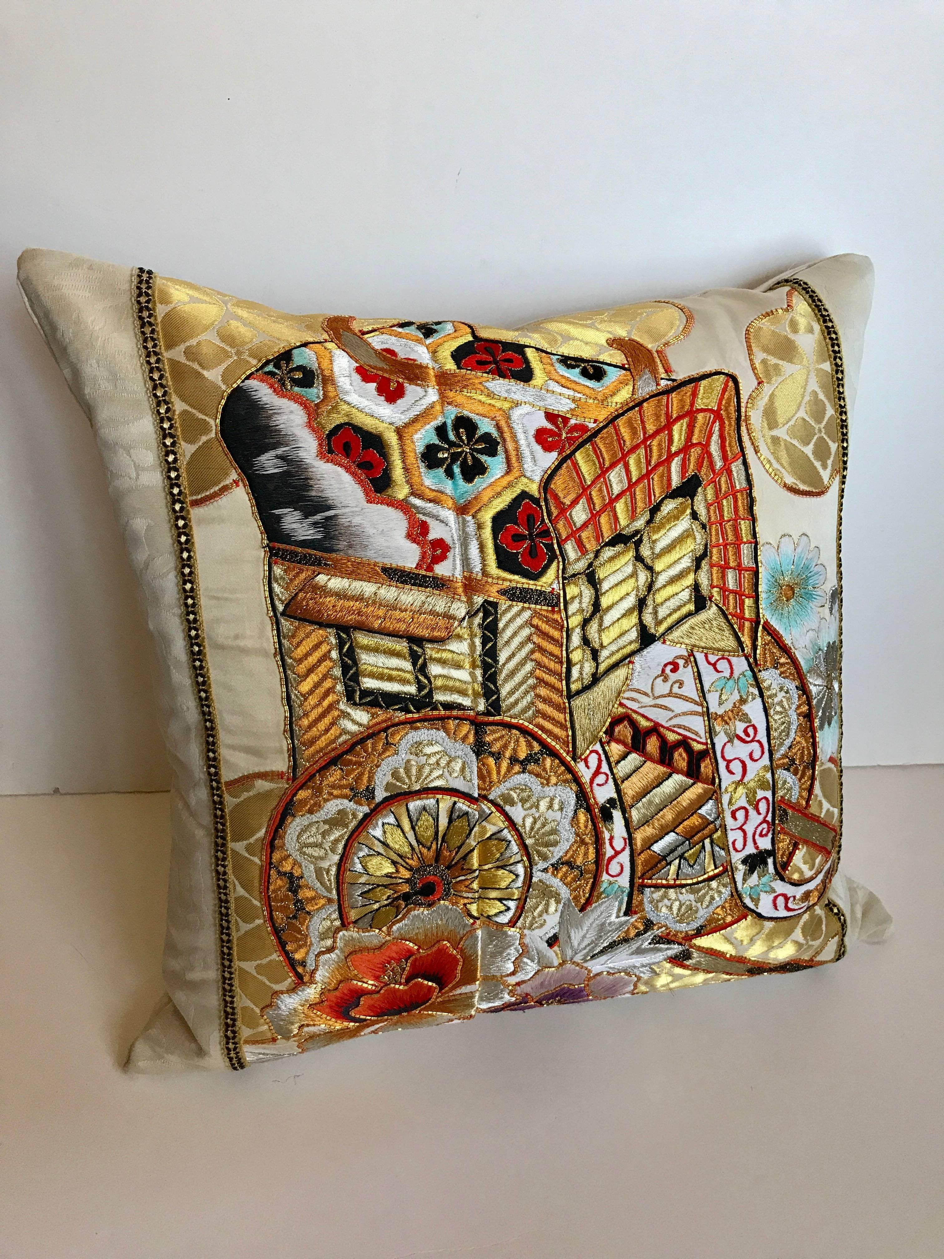 Custom pillow cut from a vintage silk Japanese Uchikake, the traditional wedding kimono. The silk textile has a design of the royal cart embroidered with metallic and silk threads. The pillow is backed in an ivory silk/linen Scalamandre textiles,
