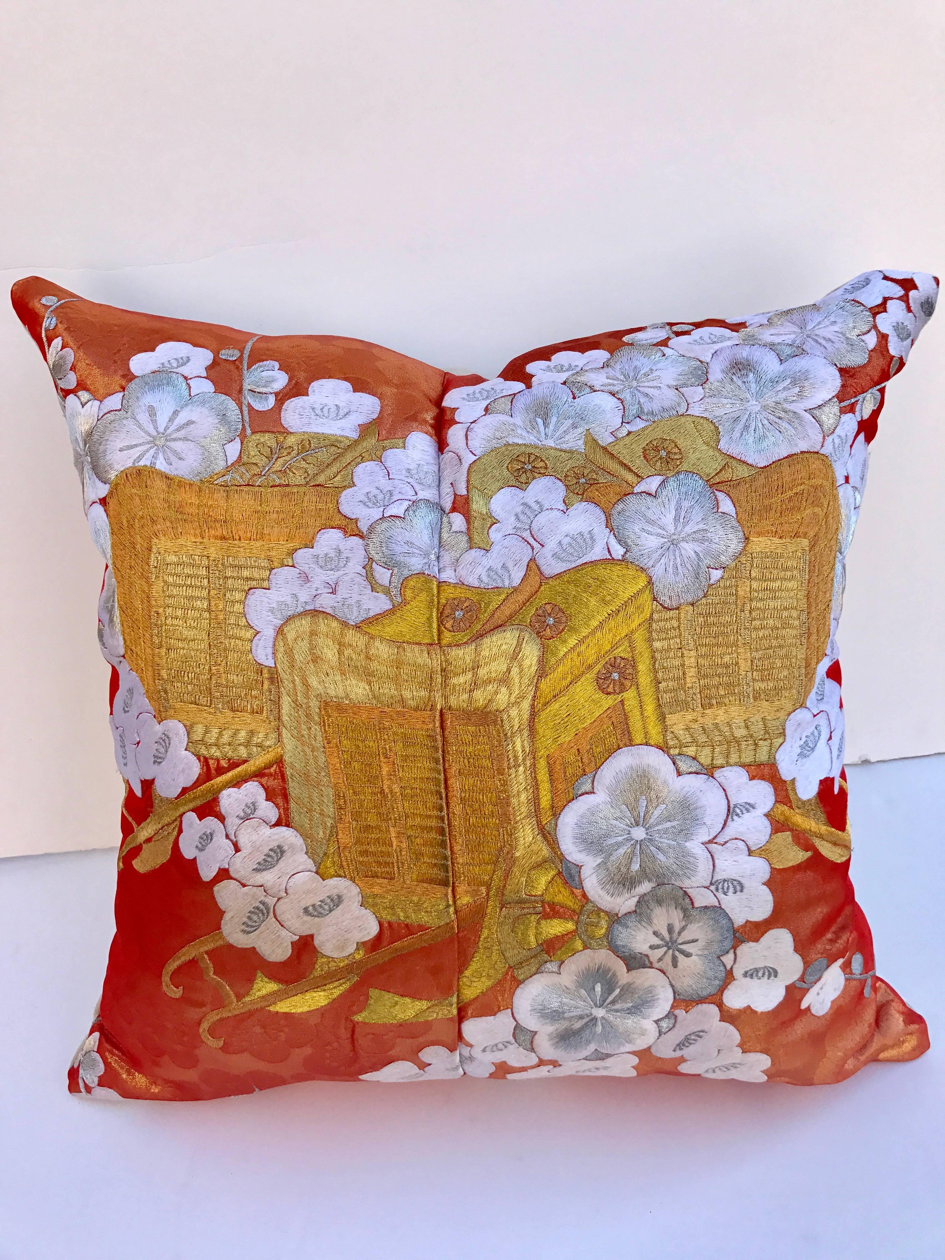 Custom pillow cut from a vintage silk Japanese uchikake, the traditional wedding kimono. The silk textile has a gorgeous design of the royal cart with flowers embroidered with silk and metallic threads. The pillow is backed with a Scalamandre