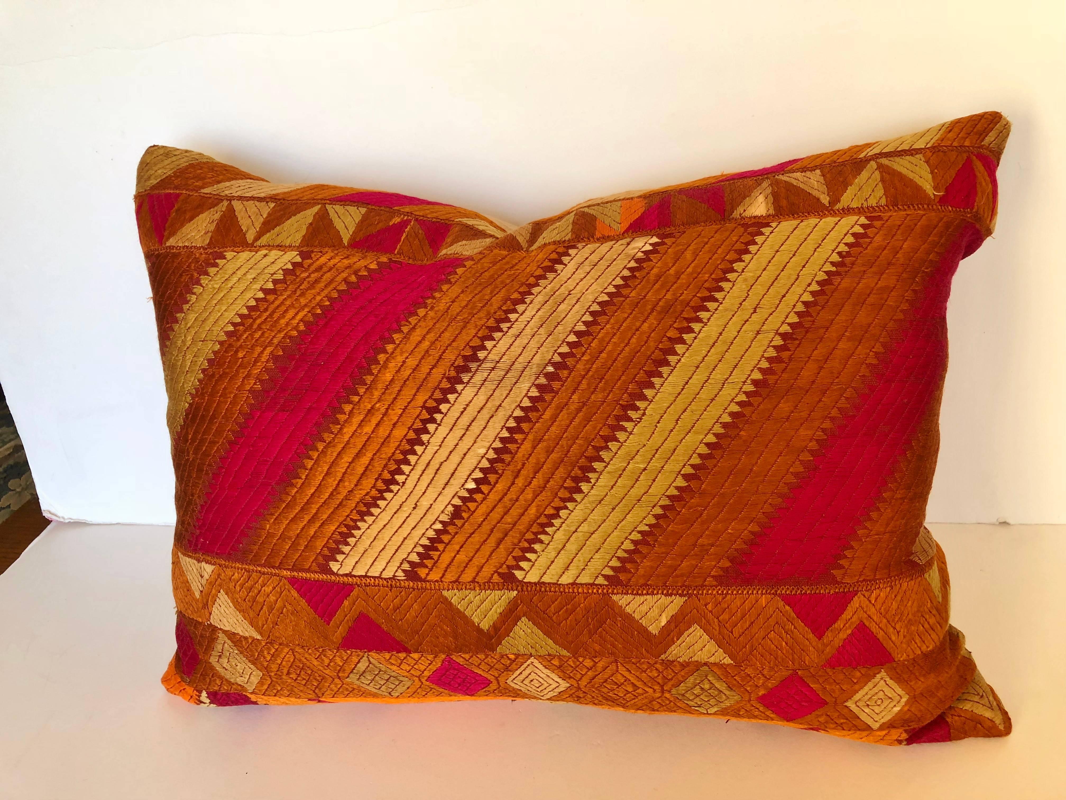 Custom pillow cut from a vintage silk phulkari bagh wedding shawl from Punjab, India. Hand loomed cotton khadi cloth is hand embroidered with vibrant silk threads. The shawl is made by relatives of the young bride for her wedding and other special