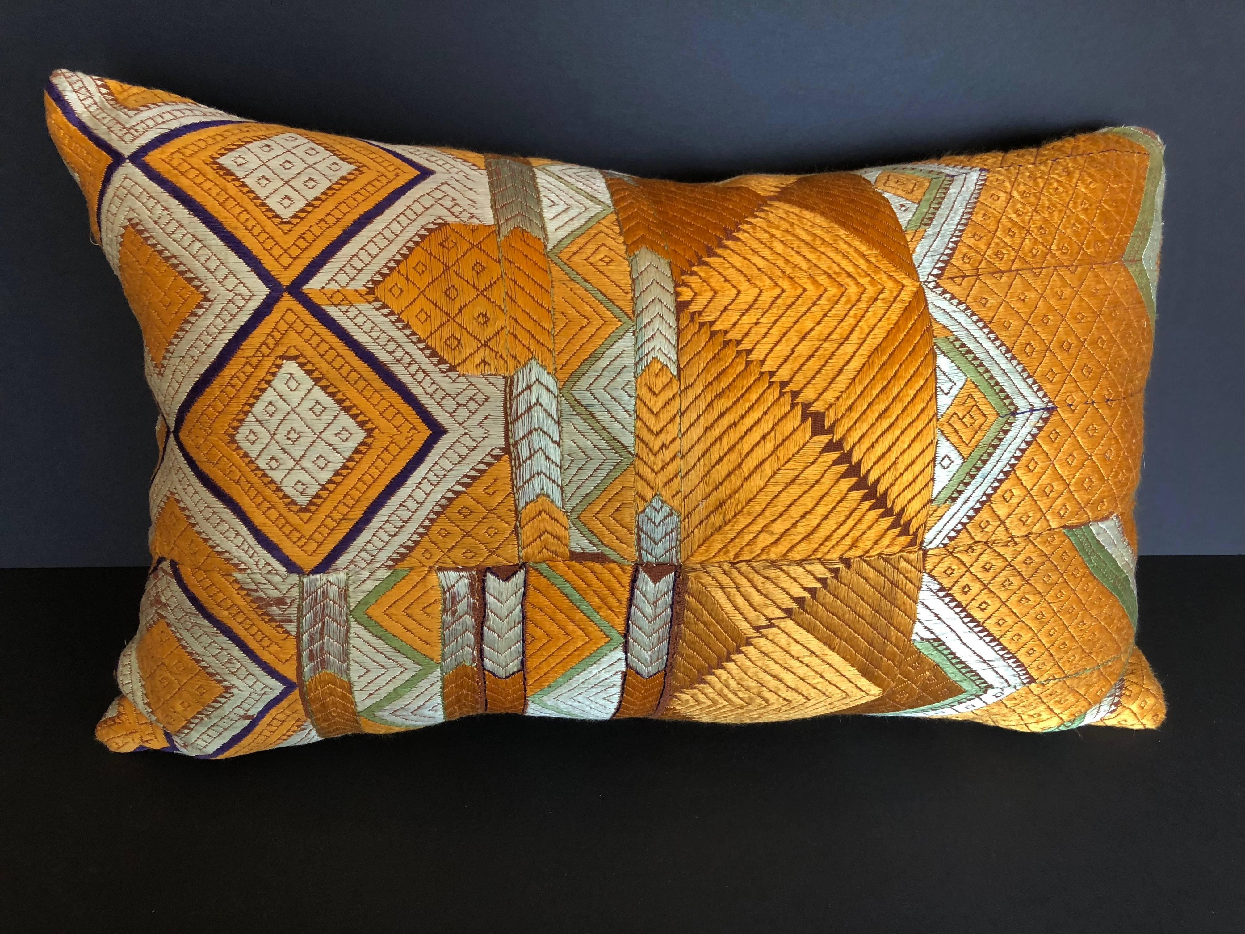 Custom pillow cut from a vintage silk Phulkari Bagh wedding shawl from Punjab, India. Hand loomed cotton khadi cloth is hand embroidered with vibrant silk threads. The shawl is made by relatives of the young bride for her wedding and other special