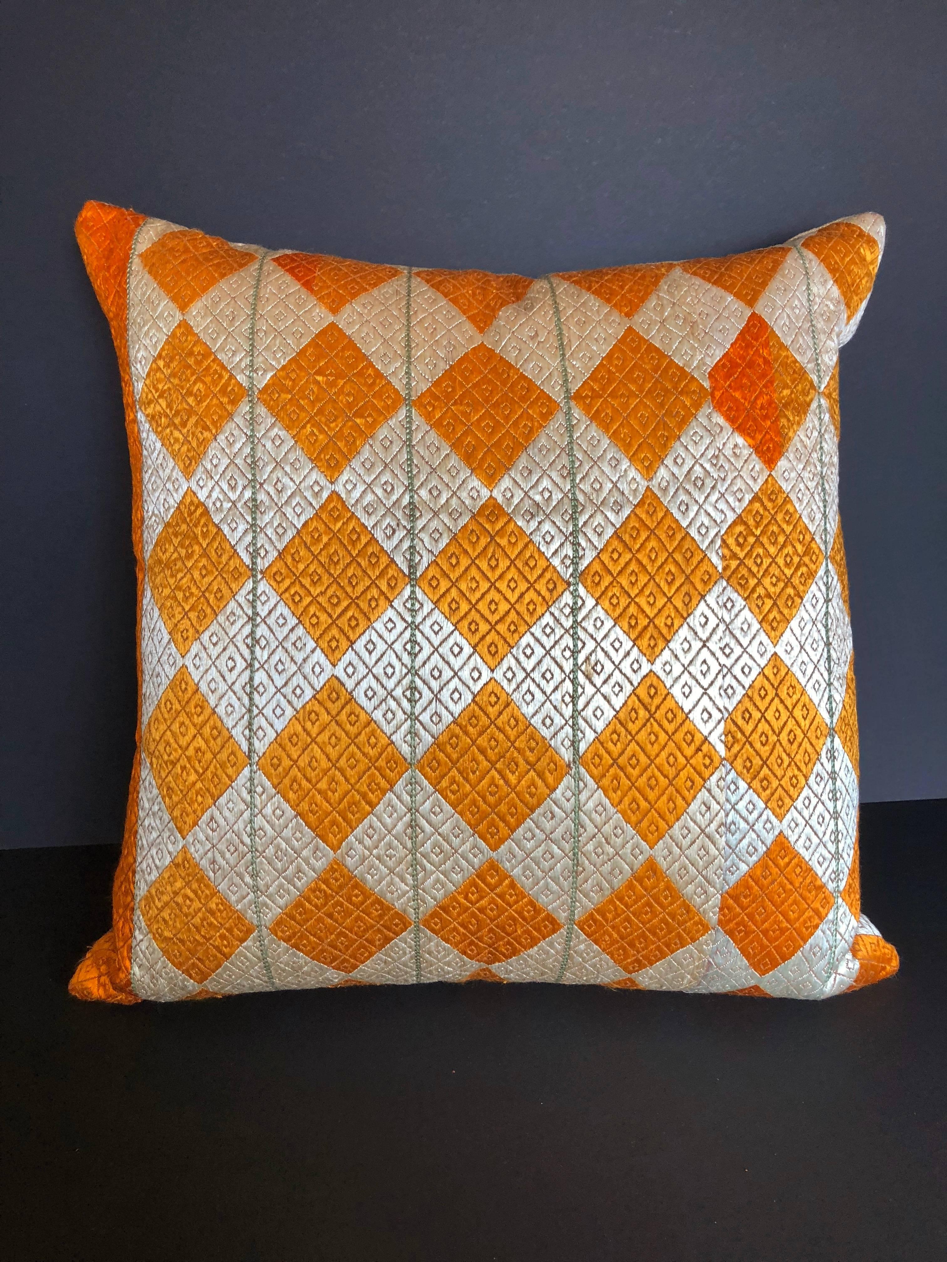Custom pillow cut from a vintage silk phulkari bagh wedding shawl from Punjab, India. Hand loomed cotton khadi cloth is hand embroidered with vibrant silk threads. The wedding shawl is made by relatives of the young bride and used for her wedding