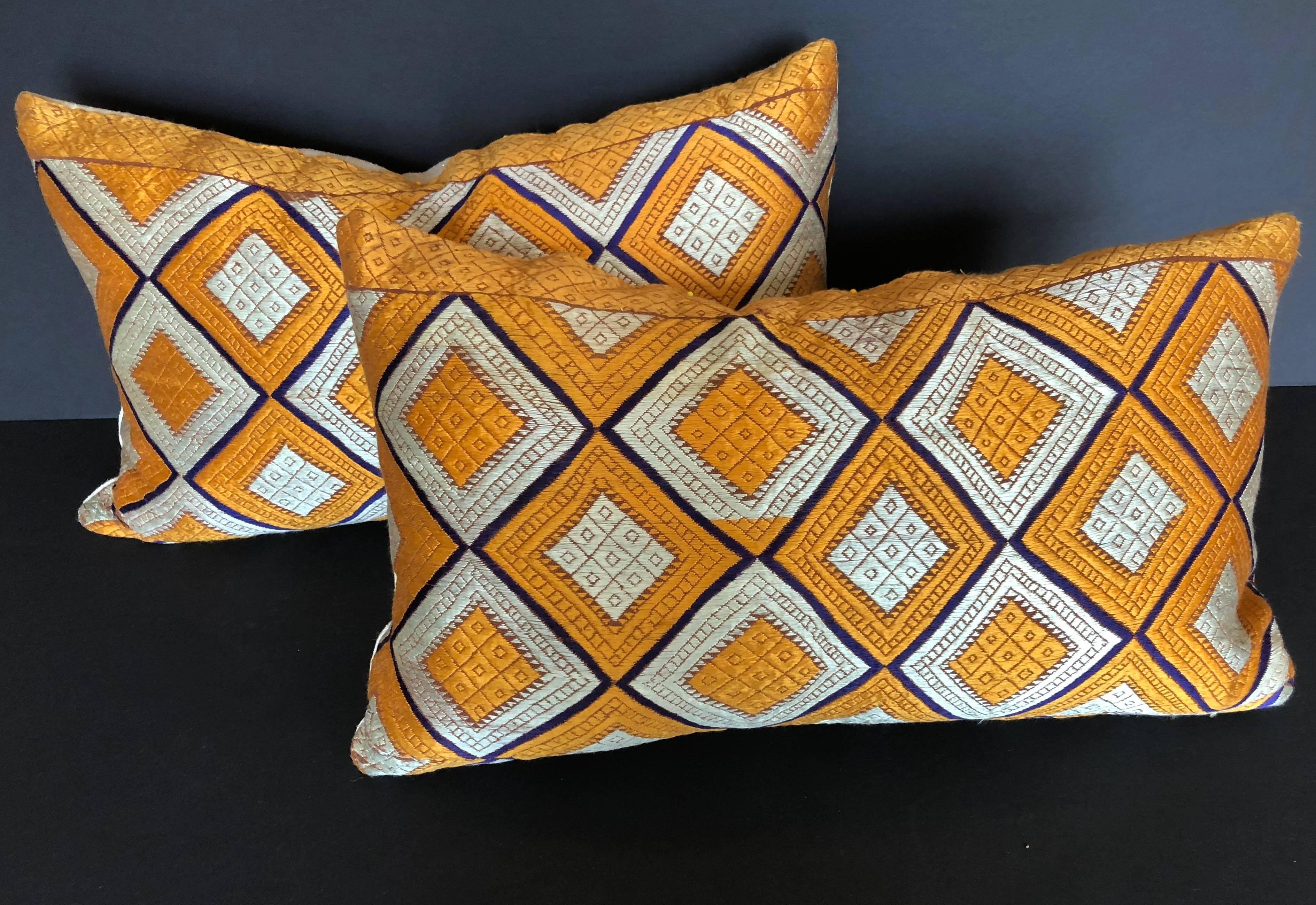 Custom pillows cut from a vintage silk Phulkari Bagh wedding shawl from Punjab, India. Hand-loomed cotton khadi cloth is hand embroidered with vibrant silk threads. The shawl is made by relatives of the young bride and worn at her wedding and other