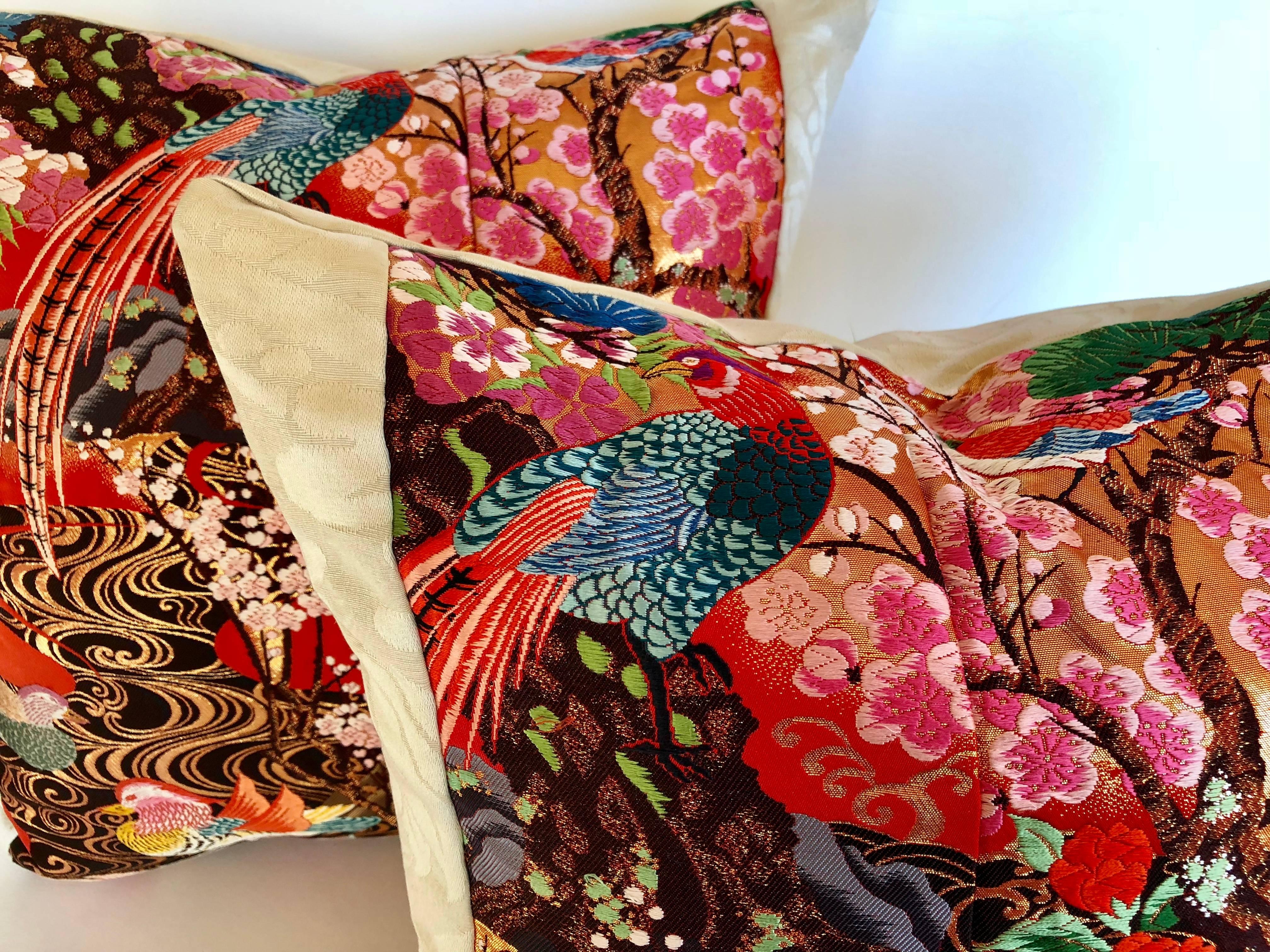 Custom pillows cut from a vintage silk Japanese Uchikake, the traditional wedding kimono. Beautiful colors with traditional Japanese floral and bird designs. Silk panel is faced and backed with a Scalamandre silk/linen ivory textile. Pillow is