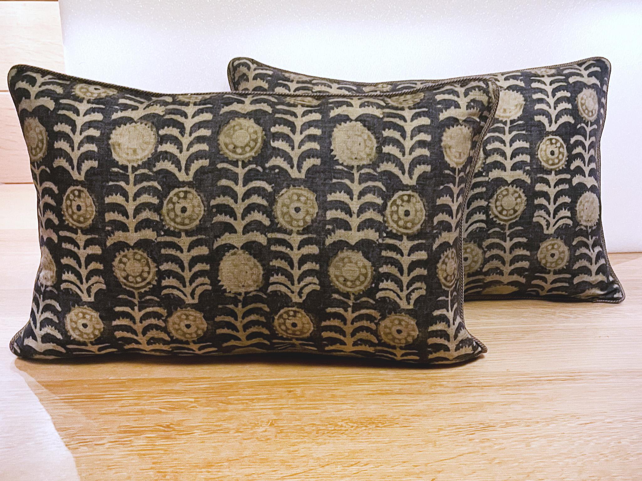 These beautifully floral patterned pillows are custom-made with a Robert Kime fabric called Tansy in indigo. This fabric is matched with a cord piping. The filling is a mix of Dacron and down, making these pillows exceptionally