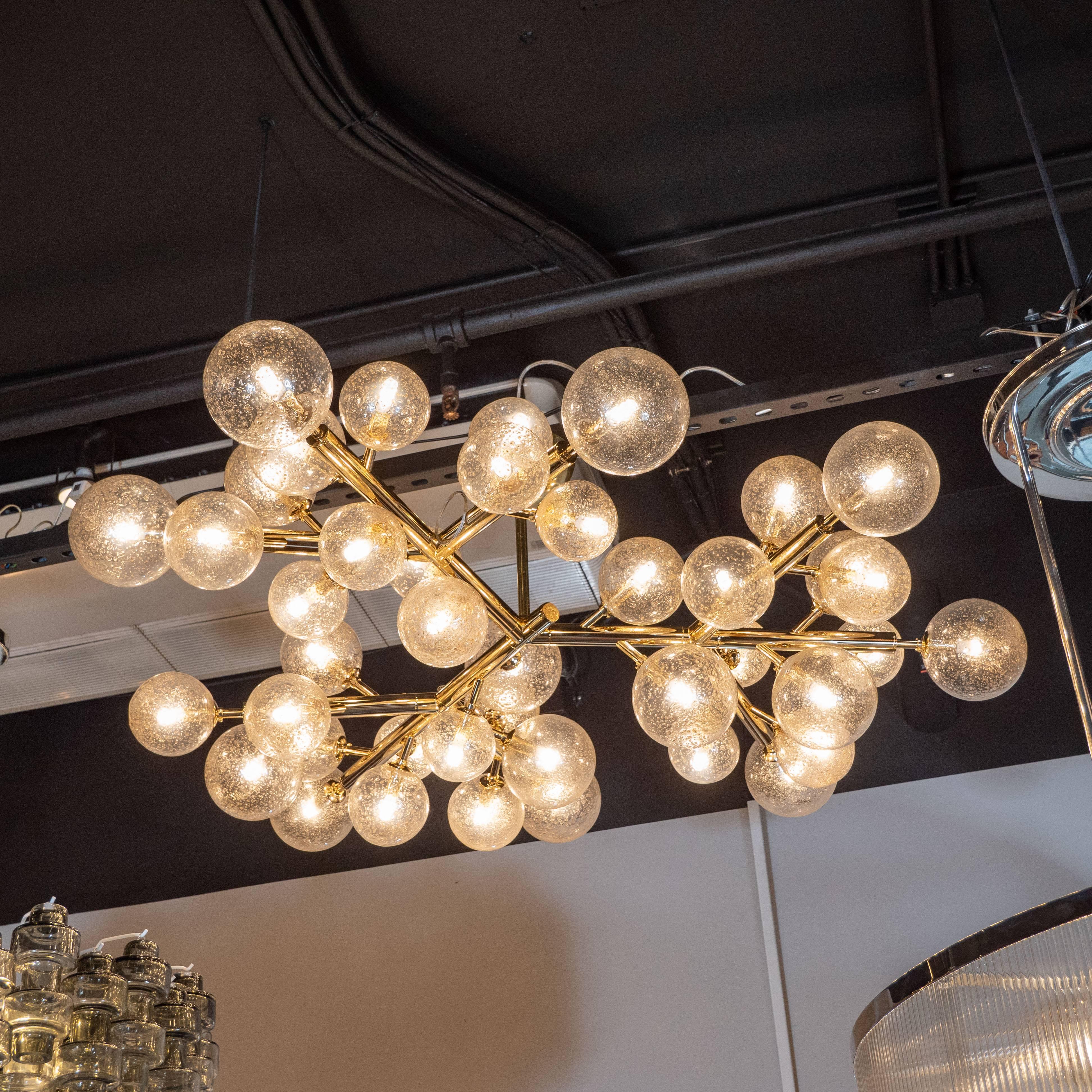 This stunning and dramatic polished brass and hand blown Murano glass molecular 