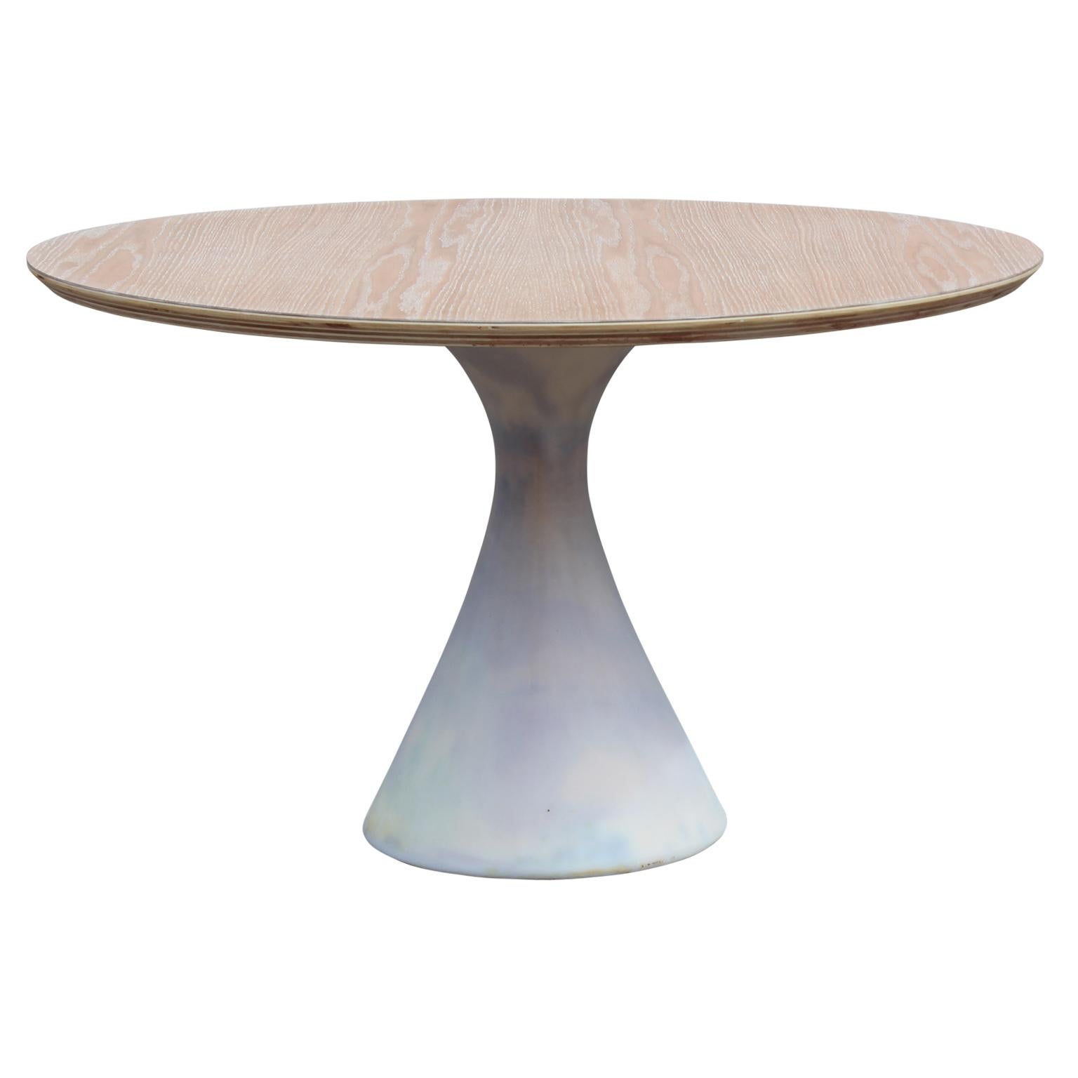 Simple and elegant custom postmodern 48 inch round tulip table made from wood in the style of Knoll and Searnen.