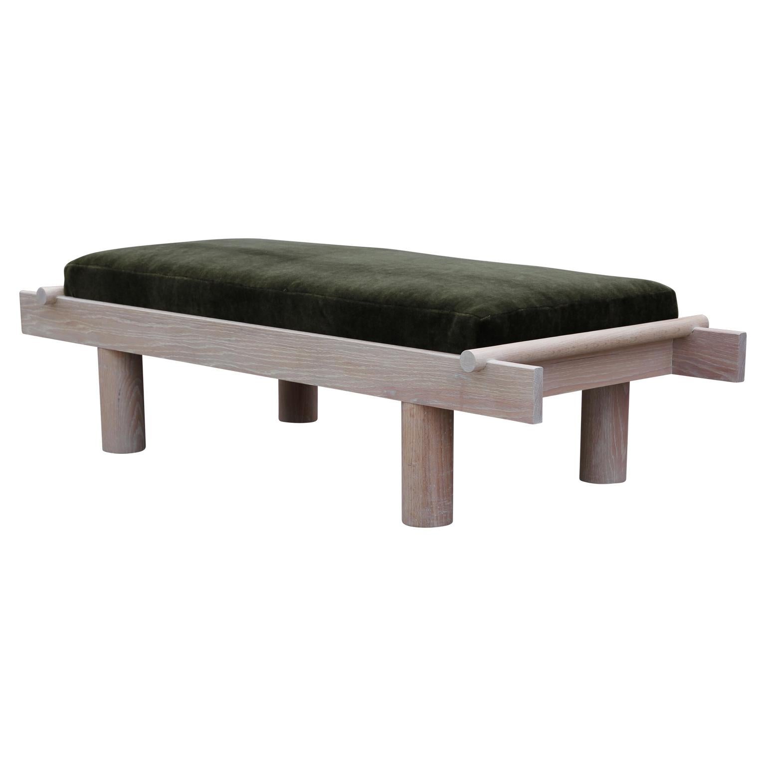 Custom made Postmodern style bench with a unique sculptural design. The bench is made from natural Cerused oak and the cushion is upholstered in green mohair.
       