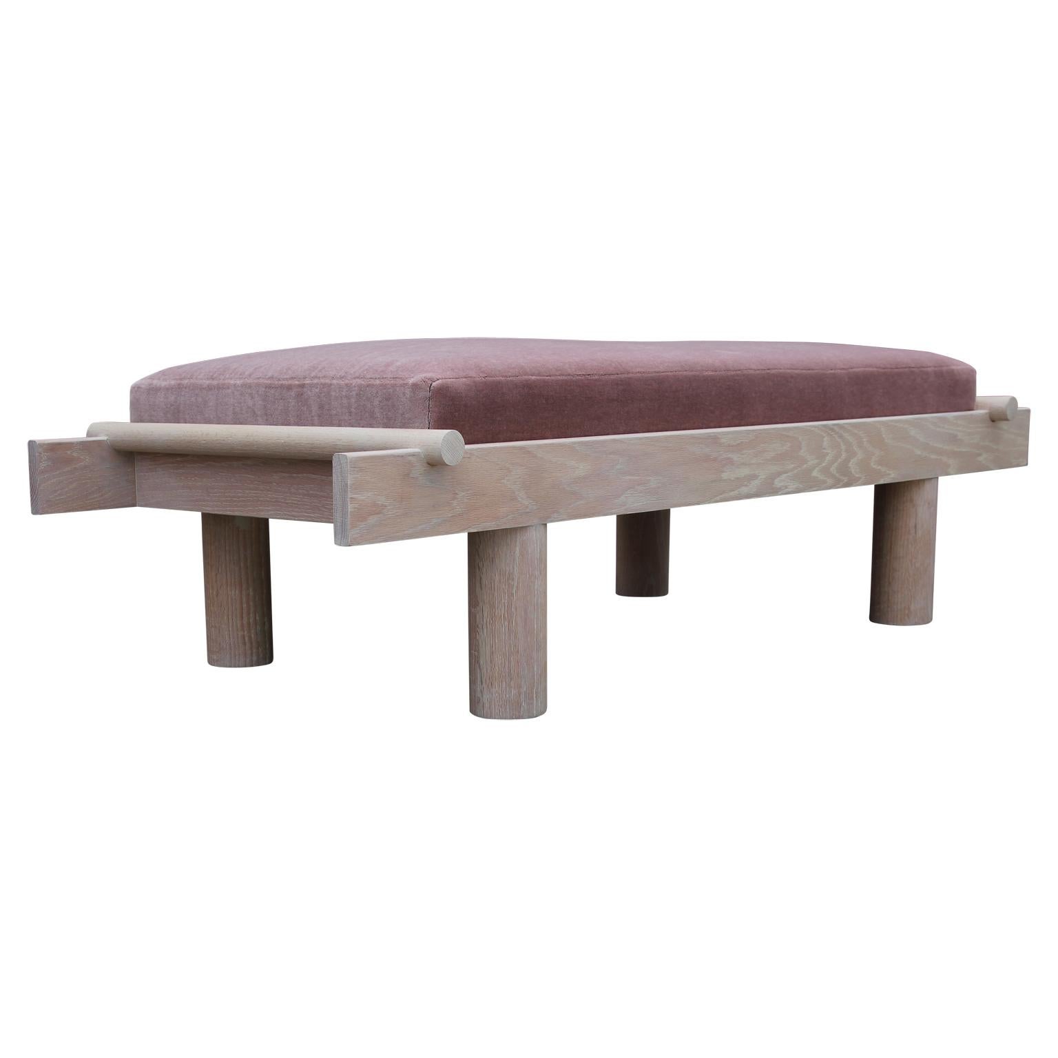 Custom made modern style bench with a unique sculptural Postmodern design. The bench is made from natural cerused oak and the cushion is upholstered in pink Kravet mohair. We can make custom sizes and finishes.