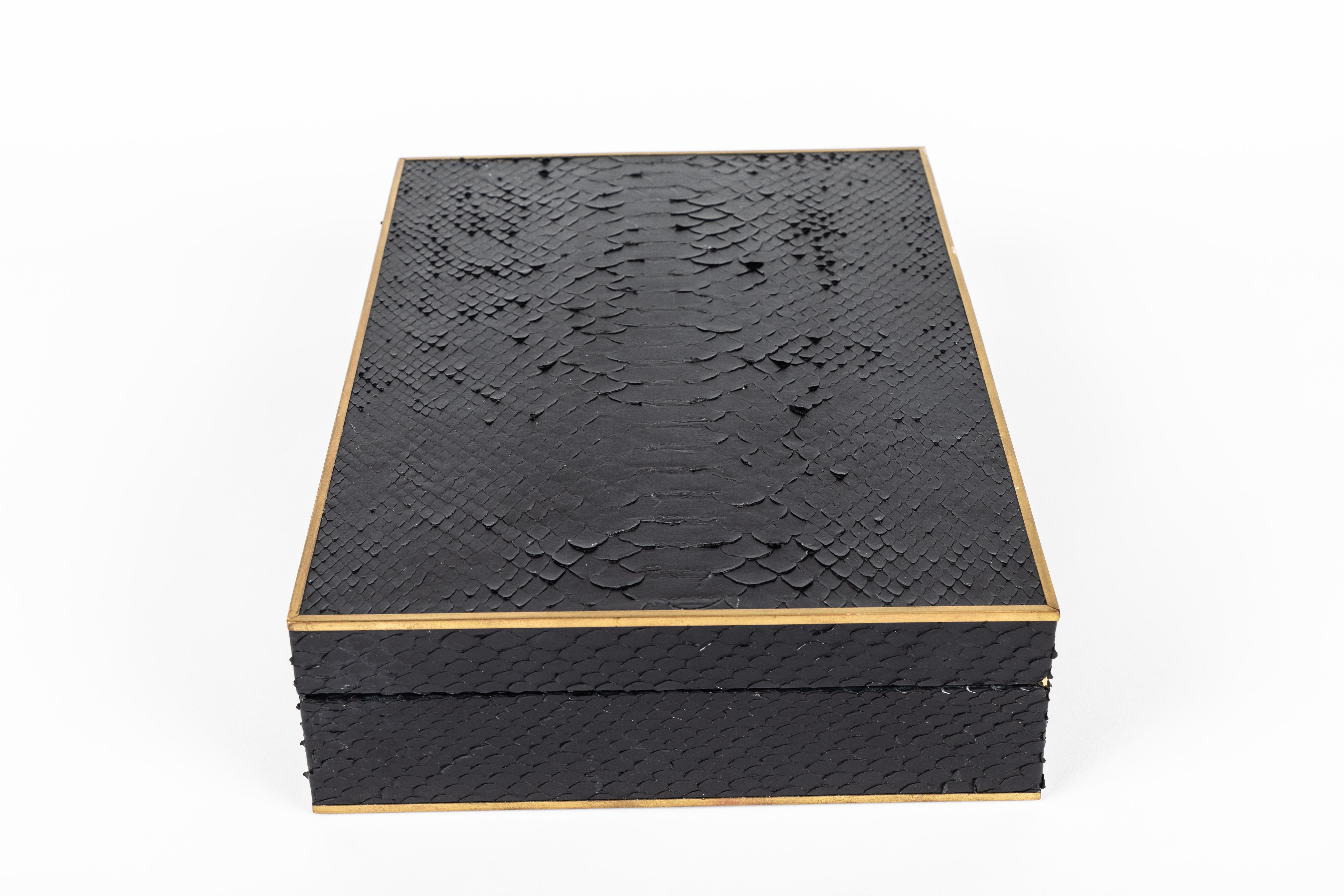 Custom decorative wood box with black python and brass edge details.