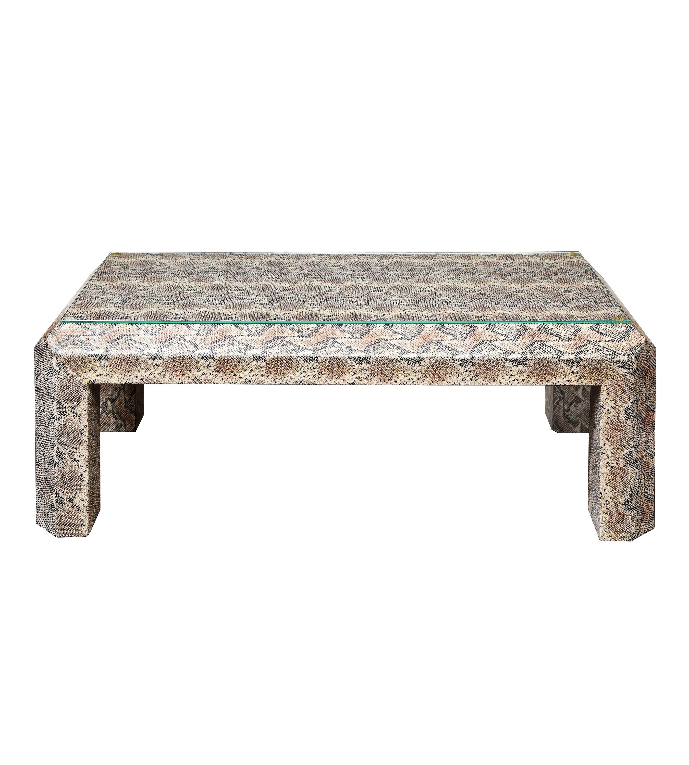 Chic cocktail table covered in exotic, black, tan and brown python skin. American 2010. This is a standout piece in any interior. 


