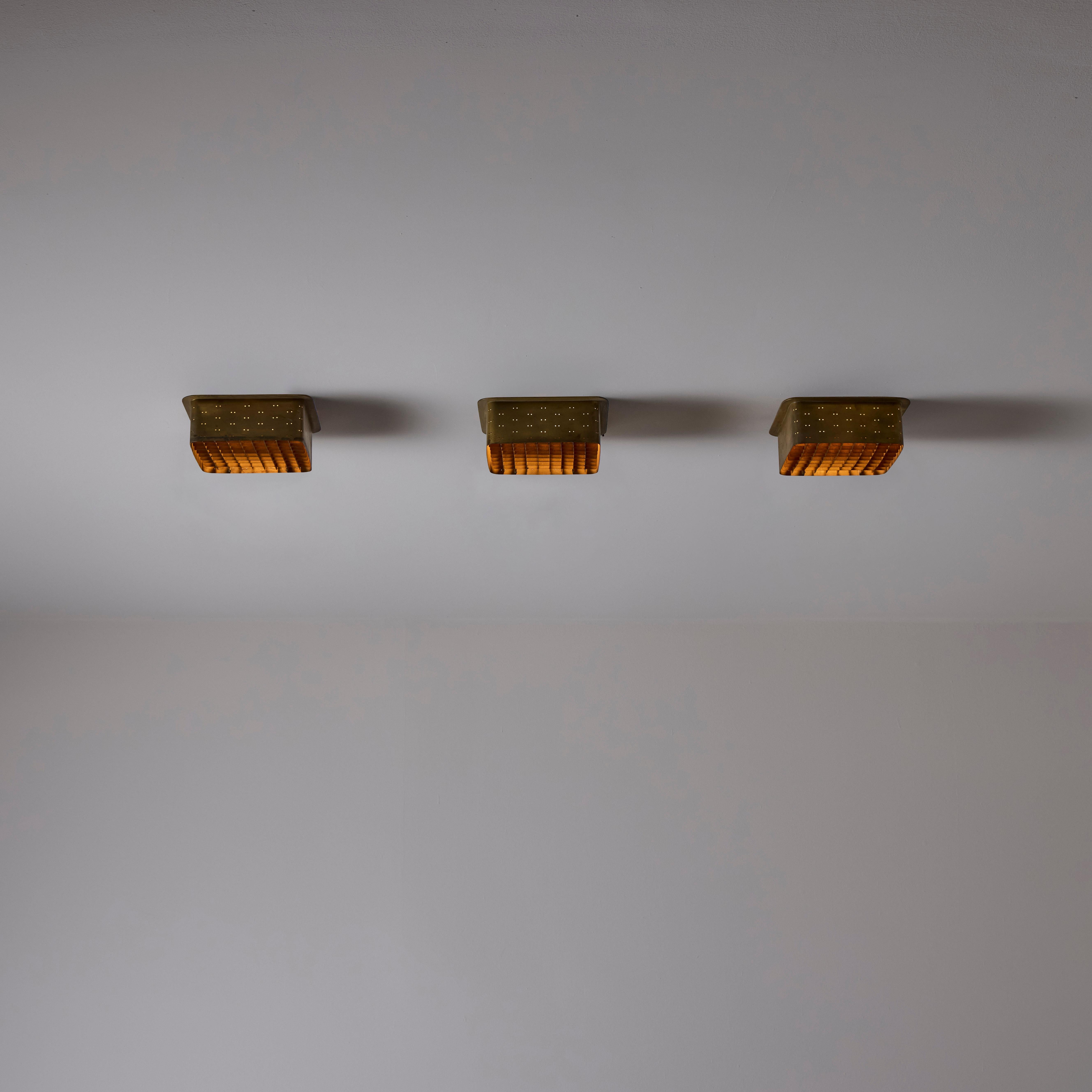 Custom Recessed Flush Mounts by Paavo Tynell. Finalnd circa the 1950s.

Perforated brass outer exterior and a gridded brass diffuser. A single E27 socket type, adapted for the US. We recommend a 40-60w max bulb or LED equivalent. Sold individually.